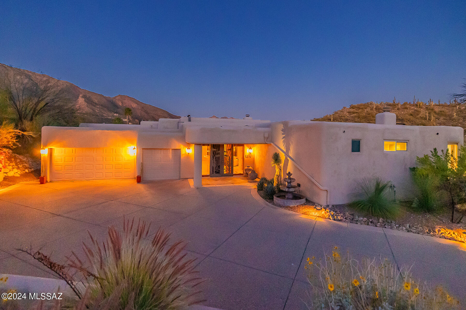 Experience breathtaking city and mountain panoramas from this exquisite 5-bedroom, 4-bathroom residence, nestled in the prestigious Alta Vista Estates. Spanning 4,382 square feet, this home marries elegance with functionality. Step inside to discover opulent 24 x 24 inch travertine flooring that seamlessly flows throughout the space, setting the stage for a symphony of luxurious living.

At the heart of this magnificent home lies a chef's kitchen, outfitted with top-of-the-line Viking and Dacor appliances complemented by stunning granite countertops—promising both culinary inspiration and sophistication. Seamless windows in the kitchen provide spectacular city and mountain views, enhancing every meal with their breathtaking surroundings. Adjacent to this culinary haven, find an off-kitchen dining area that fosters intimate family meals. Additionally, there is a large formal dining room for hosting grand dinners and a wet bar off the dining room with barstool seating, perfect for entertaining.

The grandeur extends to the primary suite, an expansive haven designed with a see-through fireplace to the primary bath. Spacious primary bath includes a jetted tub, separate shower, dual vanity, and oversized walk-in closet, establishing a sanctuary of relaxation and luxury.

This home's architectural genius is further emphasized by its split floor plan, ensuring privacy and comfort, with high ceilings throughout that elevate the sense of space. Positioned on a cul-de-sac lot, it guarantees an added level of peace and privacy.

Outside, a private backyard oasis awaits, complete with a sophisticated built-in BBQ and cozy fireplace, creating the perfect backdrop for entertaining or tranquil relaxation. The presence of a fountain in the front yard invites guests into the home, offering a serene welcome. Immerse yourself in the serenity of the sparkling pool and spa, where the stunning views of the city and mountains unfold before your eyes.