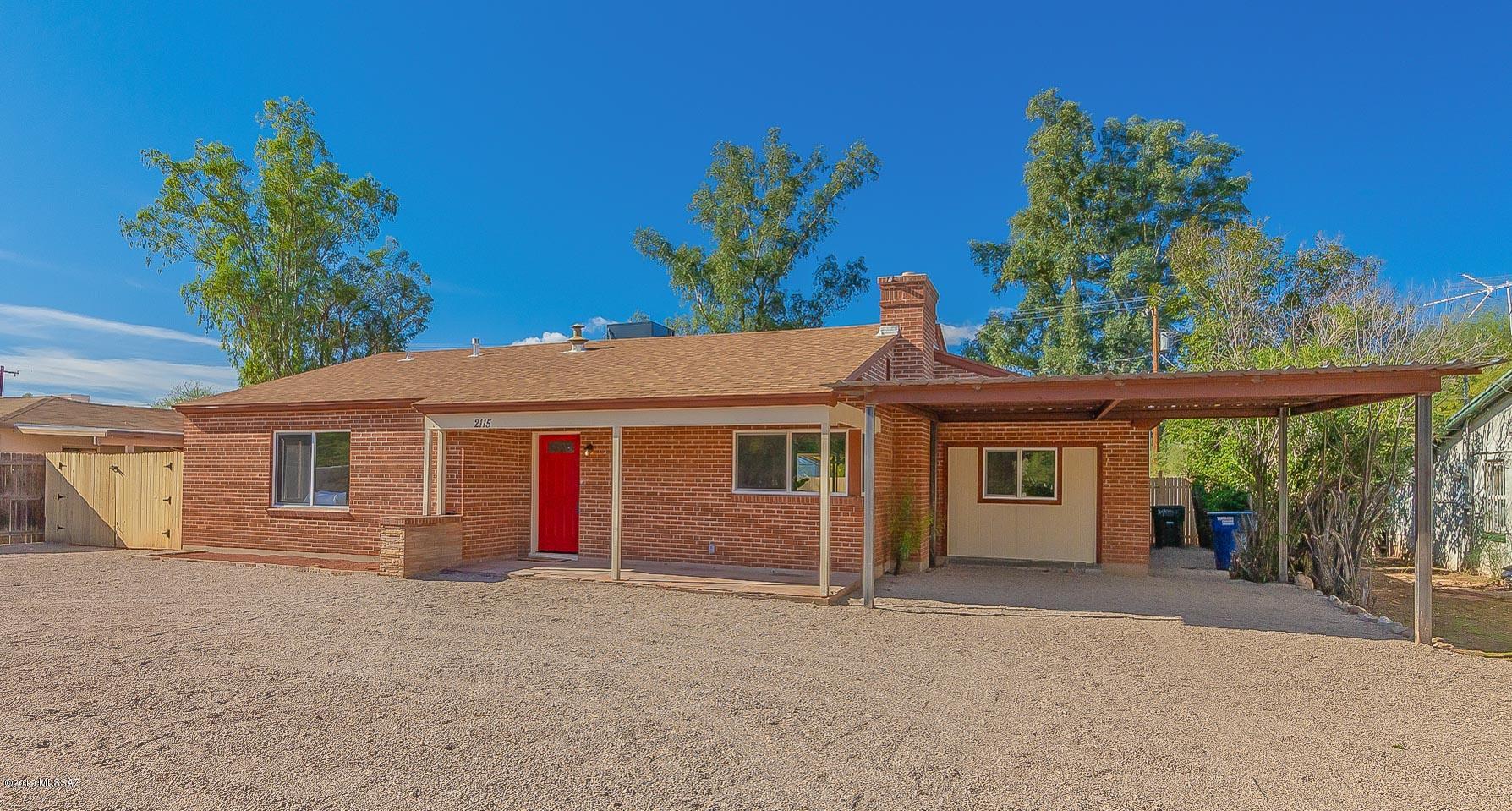Seller will accept or counter offers from 349900-354900. Beautifully remodeled 3bed/2bath ranch style home available in the heart of Tucson. Excellent central location, just a short walk or bike ride to cafes, museums, popular shopping, restaurants and nightlife and just 2 miles from the UofA. Inside is immaculate, with tasteful finishes from wall to wall. Spacious open floorplan features exposed wood beam ceilings in the living and dining areas, a charming fireplace, wood look tile flooring in all high traffic areas and soft plush carpet in the bedrooms. Modern kitchen boasts crisp white cabinetry and an island with breakfast bar seating. Master bedroom includes a private ensuite with dual sinks and a walk in shower.