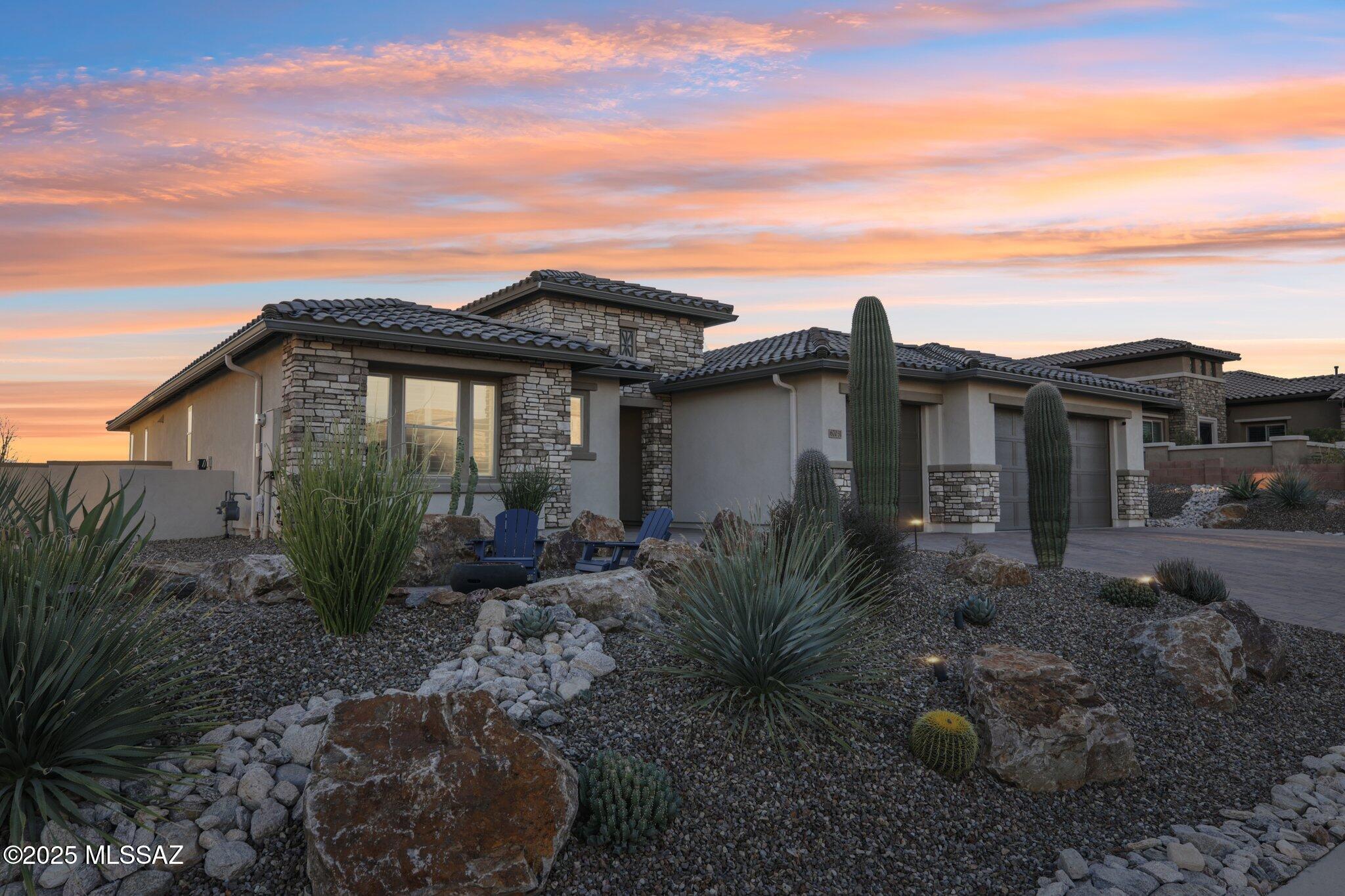 Fabulous mountain and golf course views from this expanded Paloma in The Preserve at SaddleBrooke. This 2021 home blends sophistication & functionality in an efficient floor plan with 3 bedroom suites & 3 ½ bathrooms. Endless upgrades: Wolf/Subzero appliances, granite counters/backsplash, custom closets, crown molding, custom mahogany entertainment niche. Landscaping incl. front and back firepit, built-in grill, fountain, hot tub & more. Extended covered patio w/motorized screens bring the outside in. Home equipped w/3-zone HVAC system, extra insulation, and epoxy-coated oversized garage. Water filter, water softener and hot water recirc pump. Gently live-in part-time snowbirds - selling as they needed more entertaining space for large family gatherings.