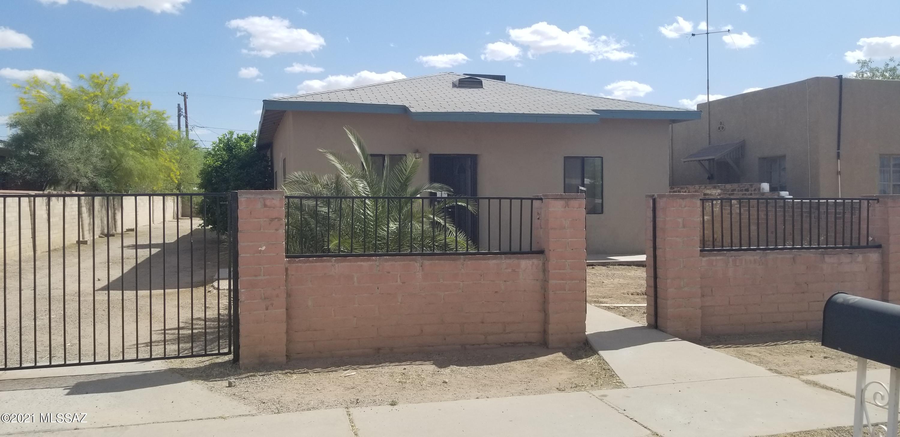 Spacious masonry home featuring 3  bedrooms, 2 baths, living room, dining area and kitchen! Large deep lot for outdoor activities or RV .   Tile and wood laminate throughout, freshly painted interior, ceiling fans in all the rooms. Open floor plan with spacious eat in kitchen ,  walk in closet in all bedrooms, Central A/C, New water heater.  Covered patio, huge backyard . Less than 10 minutes from downtown, University of Arizona, University Medical Center, VA hospital and 4th Ave district. Walking distance to Quincie Douglas Park , Rec Center featuring pool & water slide! , easy access to I10!  Within 1 mile of the newer Costco & Walmart!