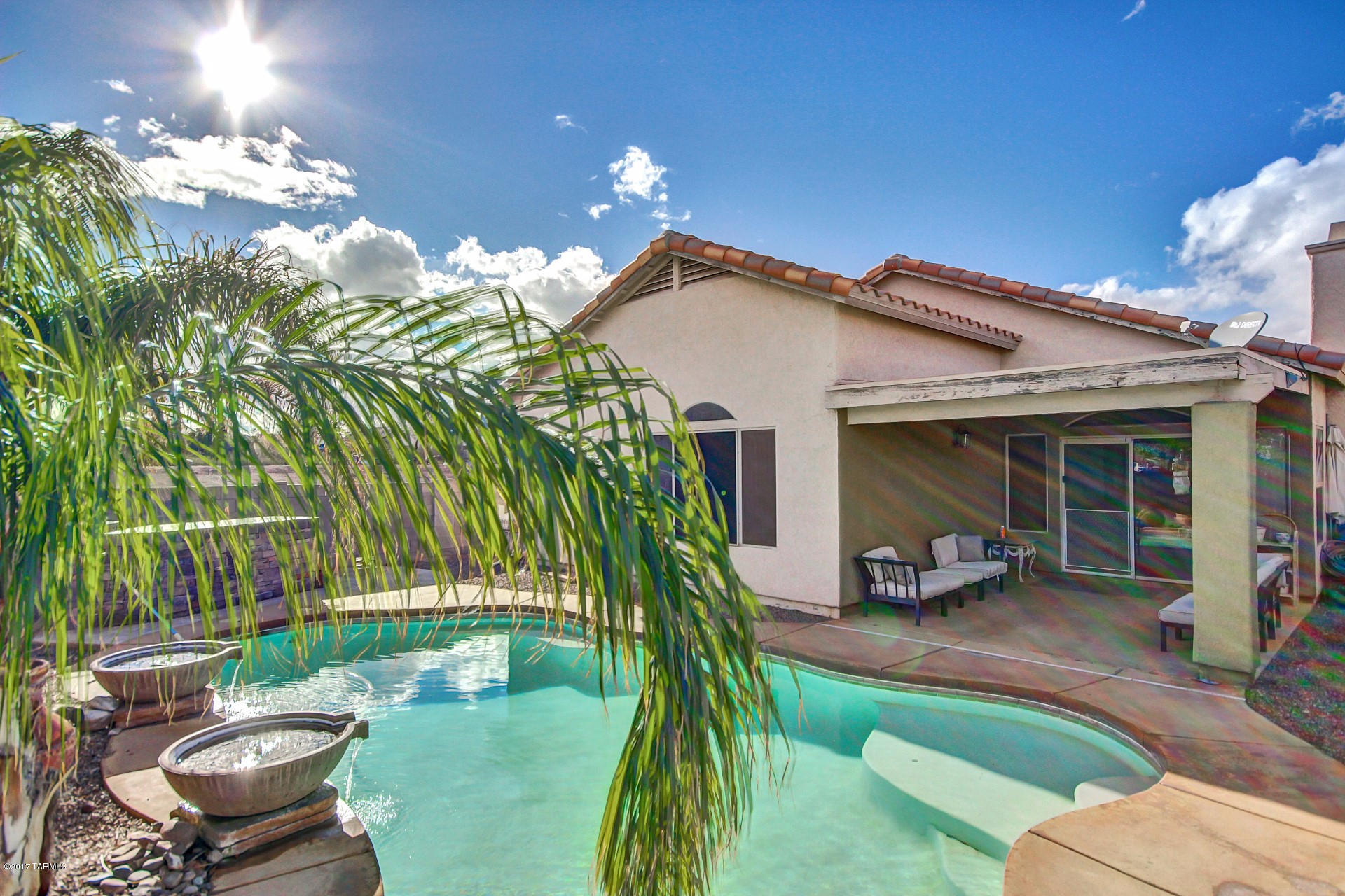Seller will accept or counter offers between $189,000 and $193,000. Home sweet home! Fantastic 3 bed + den home w/pool in great Northwest Tucson location! Wonderful open floor plan with vaulted ceilings, neutral color palette and cozy fireplace for the chilly winter nights! Eat in kitchen boasts custom cabinetry, ample counter space and pantry. Each spacious bedroom has plush carpeting. Master includes an adjoining bath. Enjoy the amazing Arizona weather from the backyard oasis! Relax under the covered patio, lounge in the refreshing blue pool or chat with the grill-master at the built in BBQ! This home is ready for your personal touches! See it today and start packing!