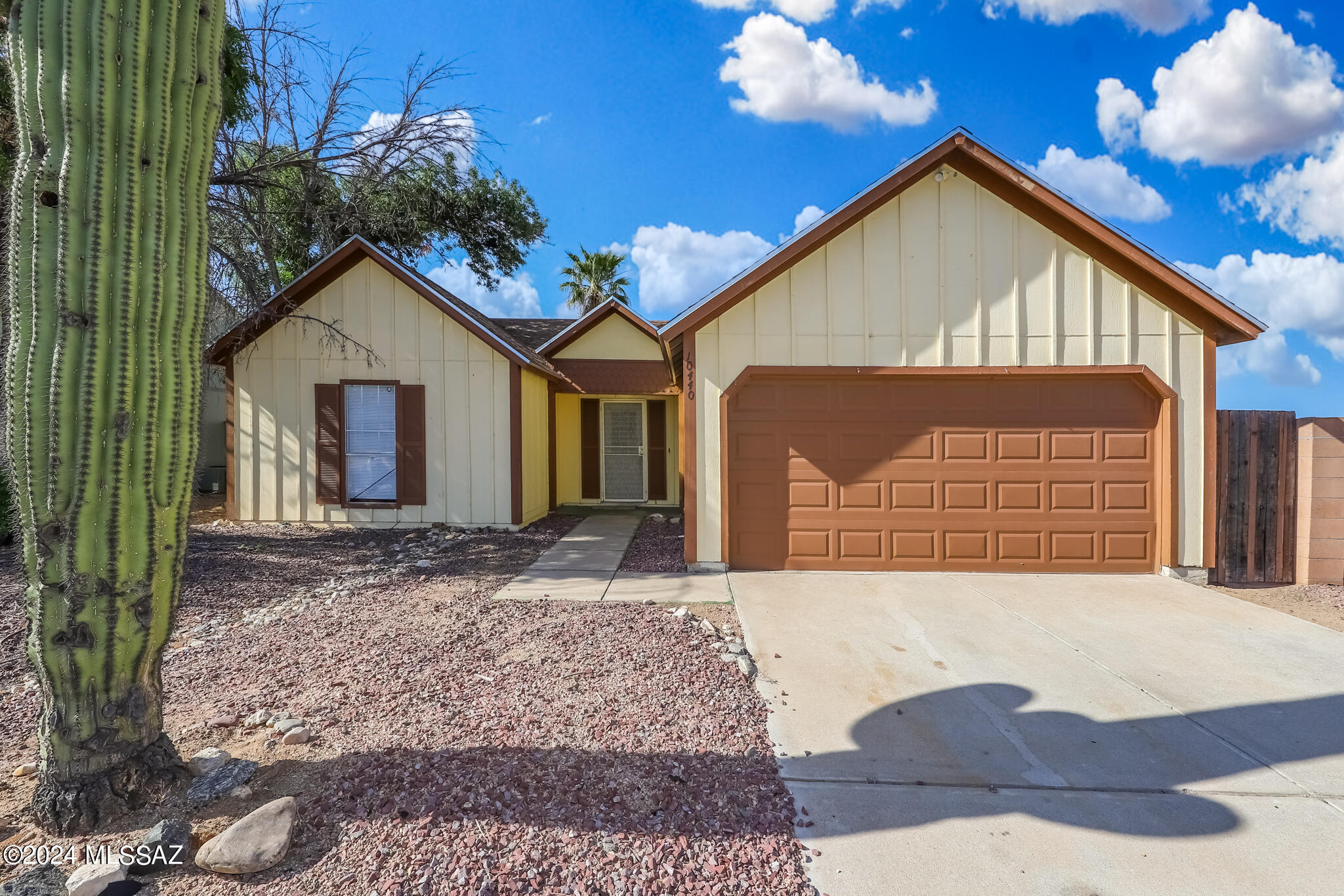 This Reszi property is spacious with three bedroom, two bath and two car garage home on a cul-de-sac. Quiet subdivision with two Community Parks. North/South exposure. Vaulted ceilings, tiled entry, kitchen, dining area and baths. Full covered patio. Mountain views. No homes to rear , adjacent to open area and wash. Very private rear yard. Take a self-tour today!