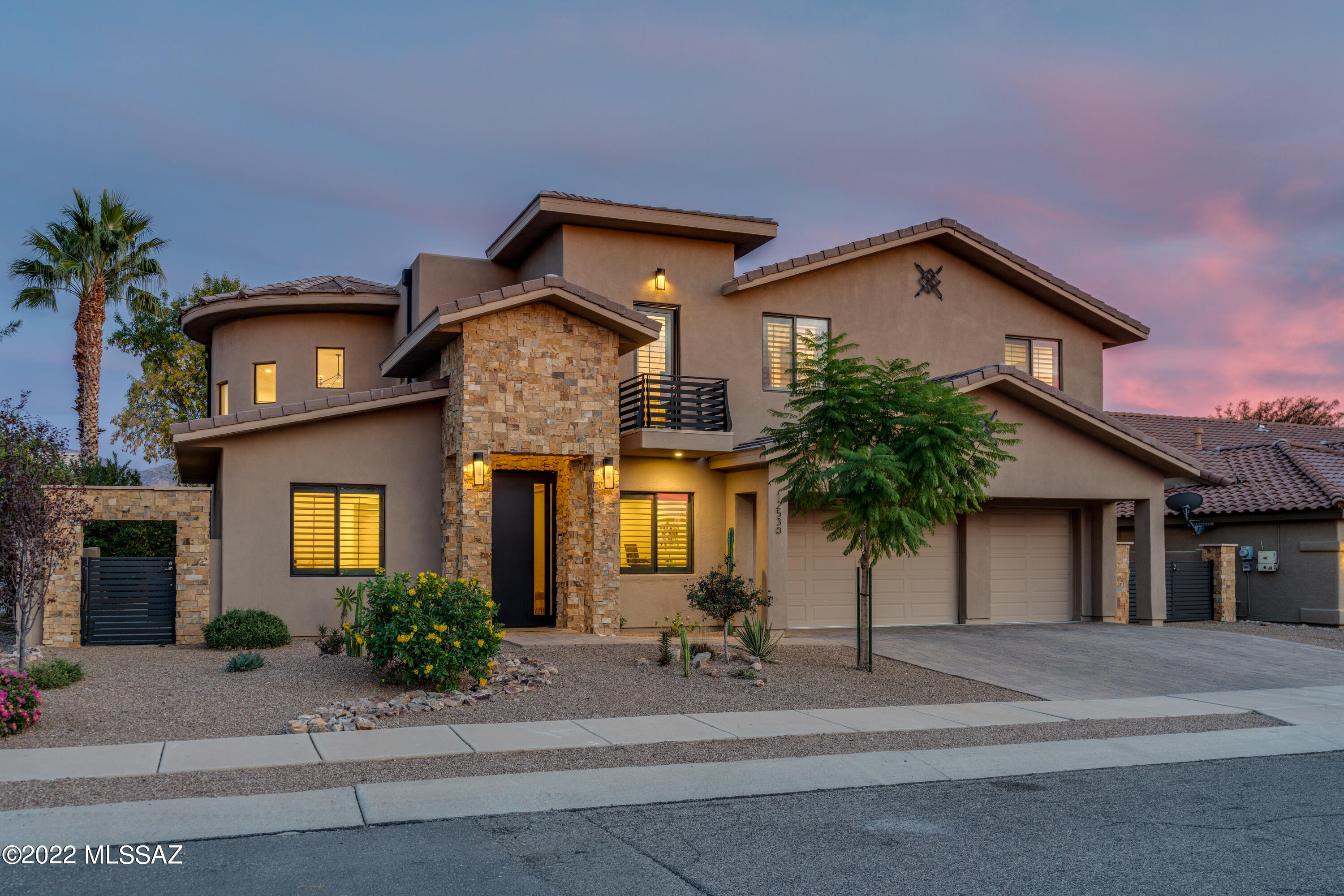 Stunning 2018 Modern Custom Home w/Views & Pool!  4Br+Den, 3Ba & 3-car garage, situated in the center of Rancho Vistoso.  Enter home through a custom swing pivot door and an inviting great room. 20' soaring ceilings, floor to ceiling dual F/P & picture windows w/ remote Silhouette window coverings. Gourmet kitchen offers quartz countertops, 12' island, soft-close cabinets, pantry, RO filtration, & SS appliances.  Gas stove w/double oven, full size side-by-side refrigerator/freezer, microwave & dishwasher. Downstairs has wood-look tile floors, large storage closet, guest bedroom & den with an attached guest bathroom w/step in shower.  Expansive wrought iron circular staircase leads to second floor master, 2 guest bedrooms & laundry room.  Private master bedroom has a separate sitting room, two balconies with Catalina Mountain views, 2 master closets and vinyl wood floors. Master bath has dual vanity, free standing soaking tub, step-in shower w/full-body showerhead & tile floors. Sizable guest rooms w/ carpet, custom shutters, walk-in closets, jack-n-jill bathroom & a balcony w/sunset views. 2 large sliders lead to a private backyard oasis with mature fruit trees, lap pool w/water features, artificial grass, extended covered patio & lush greenery. Brick driveway into 3 car garage with 22.5' depth, storage closet, Insta-hot & soft water system.  This unique home won't last long!