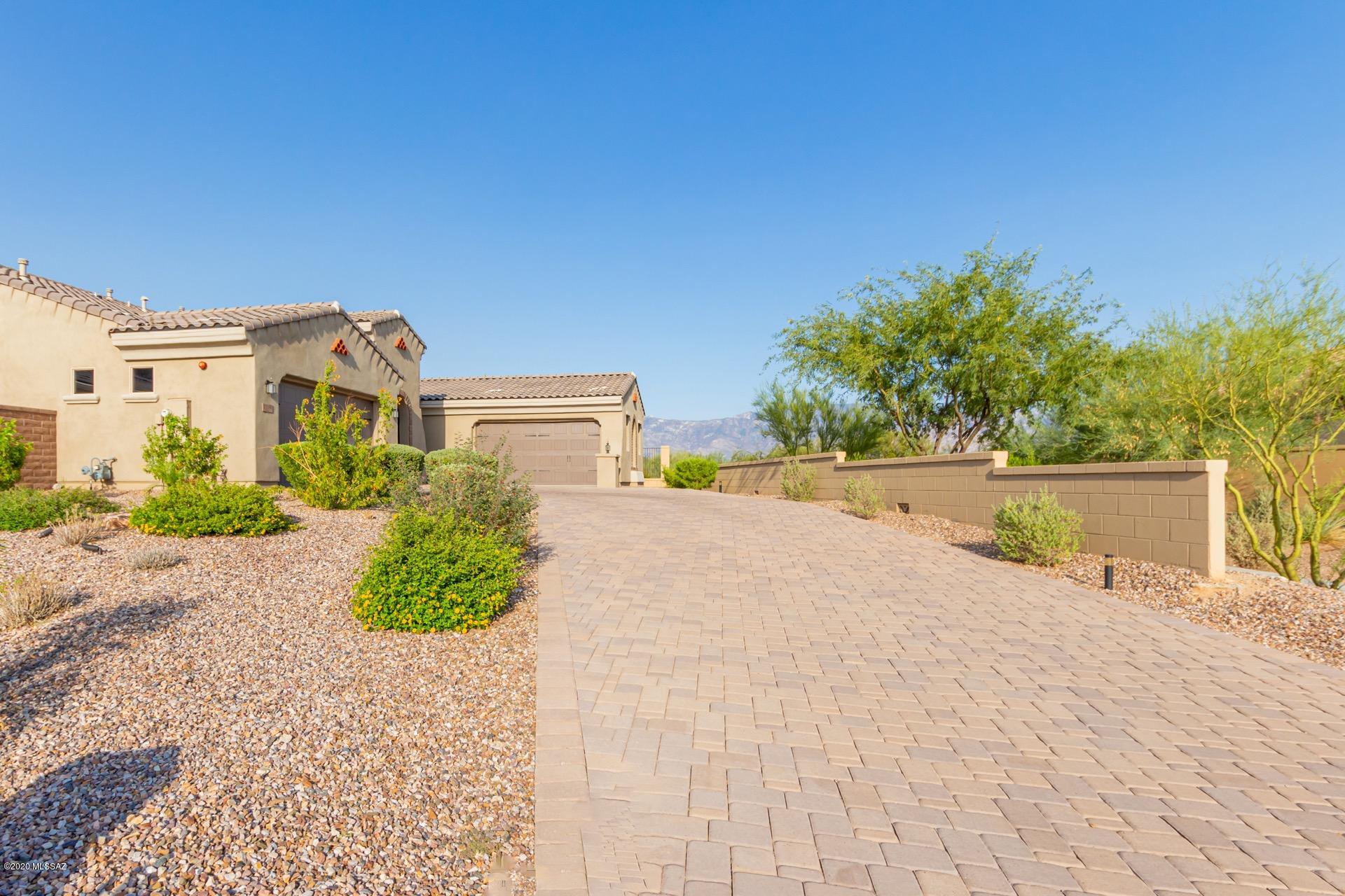 Step into Perfection! Breathtaking Mountain & Desert Views. Refreshing gorgeous pool, covered patio, synthetic turf, desert plants, & travertine paver patio all situated on a premium cul-de-sac view lot. High end finishes throughout, stone foyer accent wall, soothing palette, impressive wrought iron front door, & upgraded lighting. Formal dining room, handsome wood ''look'' tiled floors, coffered ceiling, & open floor plan. Stunning chef's kitchen features a large center island, breakfast bar, granite counters, SS appliances, glass tiled backsplash, & plethora of beautiful white cabinetry with hardware. This home offers a stylish private den, generous sized bedrooms with ample closets, & three upscale baths.Entertain with ease in the large great room leading out into the tranquil backyard where you are greeted with gorgeous views! Make your appointment to view this desert gem today.