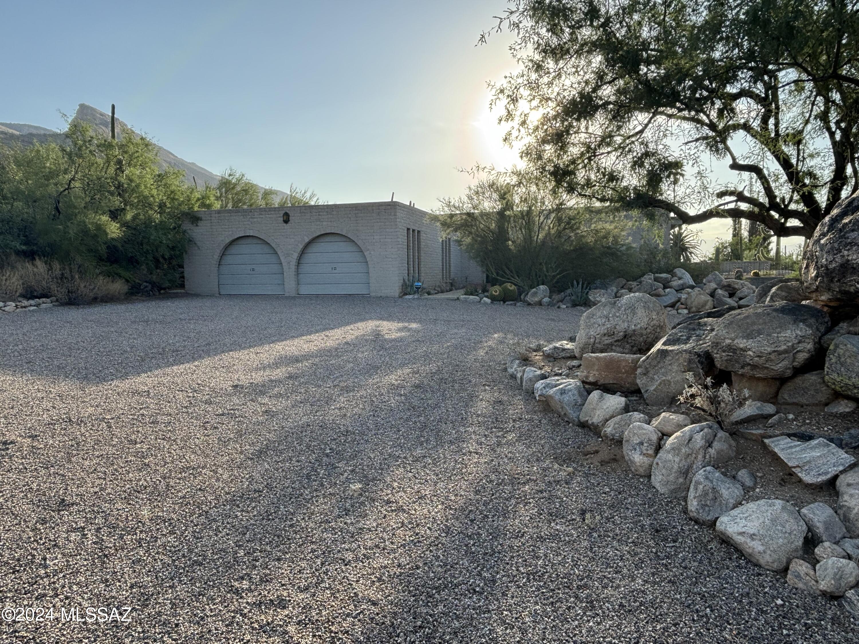This is a beautiful Foothills home on a corner lot with beautiful mountain views on the North side and fantastic city views on the Southern side.  There are large patios on both the North and South to enjoy these views, and a unique water feature on the North. Enjoy the beautiful sunrises and sunsets from the patios.
The house features many upgrades in patio doors and windows, bathroom fixtures and countertops.
The lot is natural desert landscape, with many varieties of cacti including saguaros.
