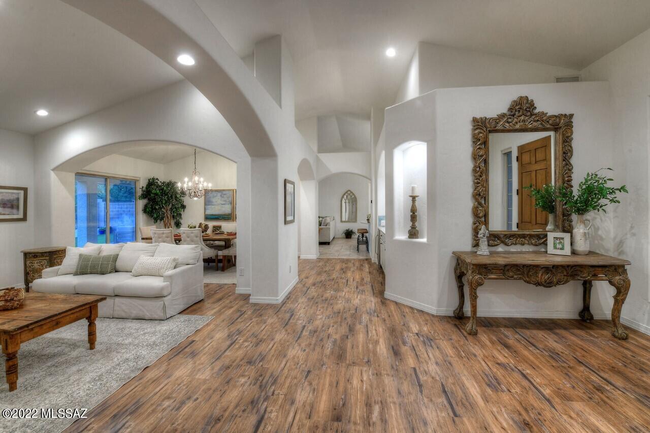 I love homes.  Most all of them. But this one is so special that it is one of my tops! Updated with a designers touch, yet still so subtle.  Think soft greens and hints of blue ( the latest thing you know!) quite simply one of the most soothing color pallets I have seen.  Windows everywhere and soaring ceilings creates such an open and airy feeling.  Rare to find a separate living room and formal dining that is anything but formal.  The kitchen and family room do just what they should do....  opens to a full patio, perfectly landscaped yard complete with turf, outdoor kitchen, and nothing behind!  Don't miss the airconditioned room in garage....  your choice what to do with it but it is so cute.AC. Roof, almost new!!!  Don't miss.