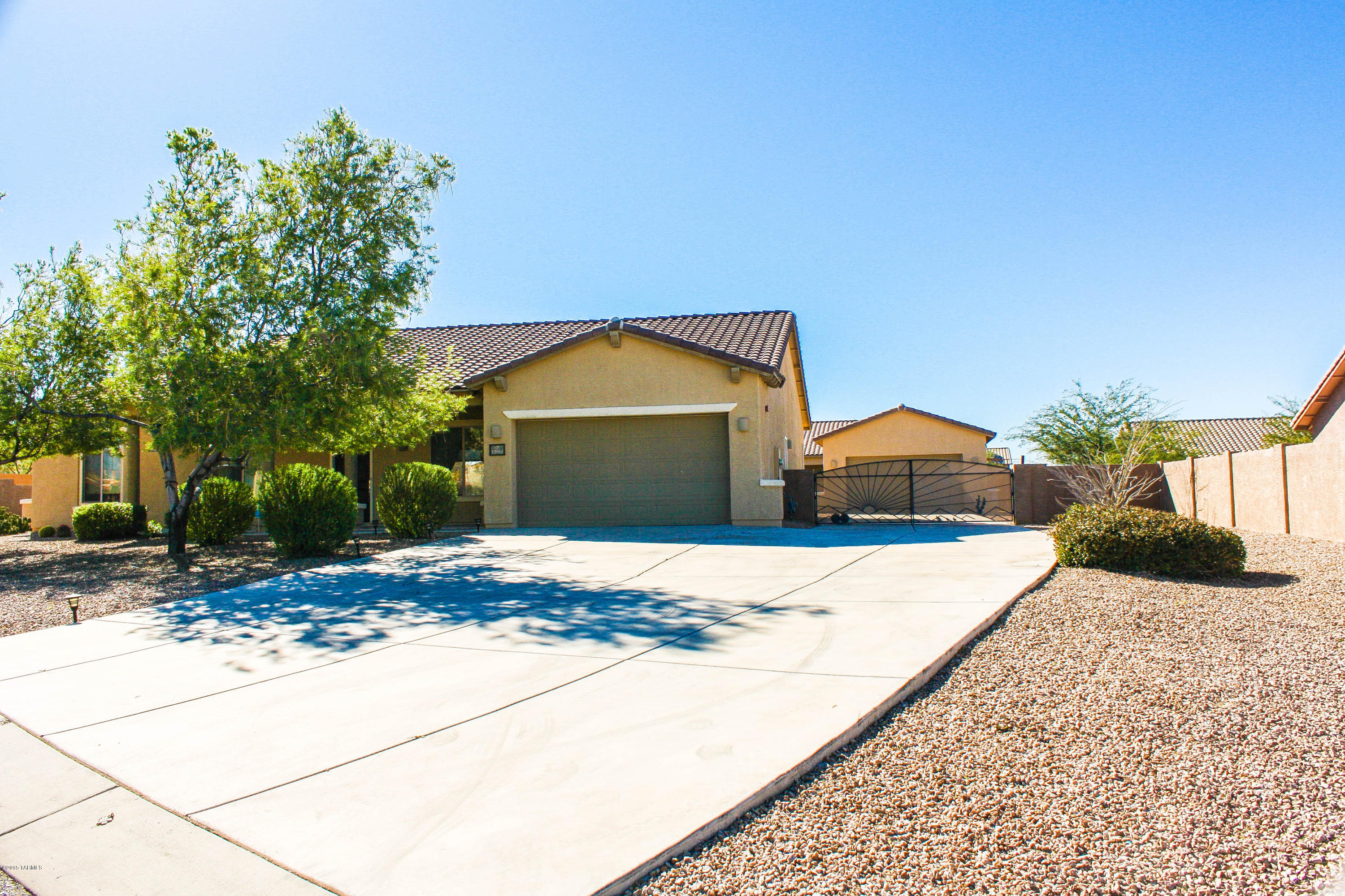 Seller will accept or counter offers between $324,900 & $334,900. Amazing Pulte SANTA CRUZ floor plan with 4BR+DEN in desirable Rincon Trails. 2576 SF single story on .43 ACRE LOT features spacious GREAT ROOM w/fireplace, custom tile w/entry medallion and large picture windows. Open kitchen w/staggered hickory cabs, granite counters, gas range and breakfast bar. FLEX LIVING SPACES including dining rm and den. MORE EXTRAS: water softener, alarm, laundry rm sink & cabs, W/D and 2 bay windows. Step out back and enjoy your own oasis w/covered patio, low care landscaping & mature trees. Plenty of rm for a pool. GOT TOYS? There's space for it all in the 5-CAR GARAGE! Attached 3-car tandem garage + long driveway w/dbl gate leads to detached, insulated 2-car garage. TOP RATED VAIL Schools.