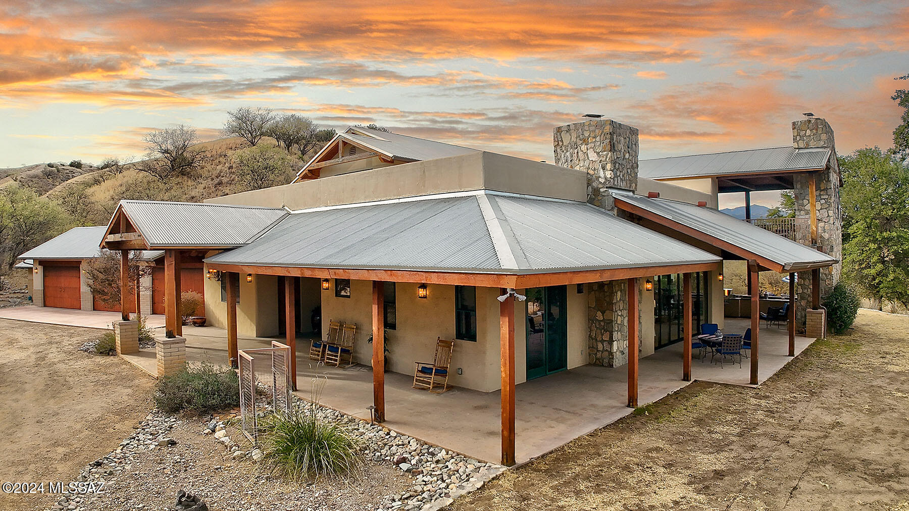 Sierra Madre Estate - exceptional 40 ac family compound of 4 homes (sleeps 25-9,766 total sf). Where Patagonia/Sonoita  meet...AZ's wine & cattle country & nestled in a wooded valley w/ Santa Rita & Patagonia Mtn views. Enter thru gated entry, horse pasture & pond to impeccable, custom retreat appealing to the discerning buyer: Hacienda Amado (5,943 sf), GH 1- Casa Amigos (4 bed/3 ba), GH  2- Casa Caballos (1 bed/1 ba) & GH 3- Casa Vaquero (3 bed/2 ba). 3 slide-away walls, balconies & 7 fireplaces offer superb indoor/outdoor living, ideal lg scale entertaining. Private well. Just over 1 hr from Tucson & 7 min from towns of Patagonia & Sonoita. Grazing allotment rights for 21k ac,  +/-10 ac + existing barn, pens, corral, for sale for add'l $1,950,000 under sep sale. Cattle not included Main House: Hacienda Amado
5,943 sf. Built in 2008
First floor: Features: Chef's kitchen - Viking appliance pkg, Imperial plaster walls, high tongue & groove wood ceilings & Kolbe wood aluminum clad windows throughout & imported wood interior door, Primary bedroom with bonus seating room, his/her closets, clawfoot tub, double vanity, bonus area, & formal office, guest suite - ensuite & 2 full bathrooms, concrete/metal walled "saferoom", formal Butler's pantry, 4 fireplaces, slide-away walls, wrap around patios, full outdoor Viking kitchen, full bar & storage rooms/additional refrigerators, upscale/top-of-the line timeless finish levels throughout
Second floor: Flex/Recreation room, 5 built-in twin beds, 2 full bathrooms, 2 fireplaces, full outdoor patio, office area
3 car integral color-concrete garage including storage room (AC) & workshop. Raised vegetable garden just outside the garage.

Guest House 1: Casa Amigos
1,650 sf. 	4 bedroom/3 baths
Gated courtyard, separate parking & entrance & outdoor kitchen & mesquite grill, washer/dryer, fireplace, Mexican tile, multiple patios for indoor/outdoor entertaining, dog kennel area

Guest House 2: Casa Caballos
813	sf. 	1 bedroom/1 bath
Large Covered patio, washer/dryer, great room concept

Guest House 3: Casa Vaquero
1,360 sf. 	3 bedroom/2 baths
Large Covered patio, washer/dryer, hickory cabinets, fireplace

Exceptional Biodiversity
Landscape: Citrus trees, Grasses, forbs, shrubs, (blue, hairy, sprucetop, sideoats & black grama), curly mesquite, threeawns, vine mesquite, Texas timothy, mesquite mountain mahogany, cliff rose & manzanita. Trees: black walnut, cottonwood, sycamore. Oak & juniper (most prevalent)
Wildlife Mearns's quail, coues deer, bear, lion & javelina
Birding - More than 300 species of birds have been seen in the Patagonia area. Of particular interest are the Gray Hawk, Vermilion Flycatcher, Violet-Crowned Hummingbird, Thick-Billed King-Bird, Zone-Tailed Hawk, Green Kingfisher, White-Throat Sparrows (in winter) and Black-Bellied Whistling Duck.

About Hacienda Amado
Owned by historic ranching family from Amado, AZ (Ranched continuously in the area since 1840's...180 years - 7 generations of ranchers) 

 Located in SE Arizona - Considered one of the best cattle ranching areas in the Southwest US
Elevation - majority of ranch 4,500 ft, highest point at 8,000 ft
Daytime temps in summer more temperate/nights are cool
55 miles from Tucson International Airport, 25 miles from Nogales
Zoned GR

Bordering Temporal Allotment/Cattle Heard & Grazing Rights
Under separate sale (additional $1,950,000). Livestock not included in the price of the Hacienda, but may be purchased separately - Year-long Cattle Operation - 21,607 acre grazing permit rated for +/- 300 herd
Herd type: Brangus cows from registered Brangus bulls 
US Forest Service Allotment