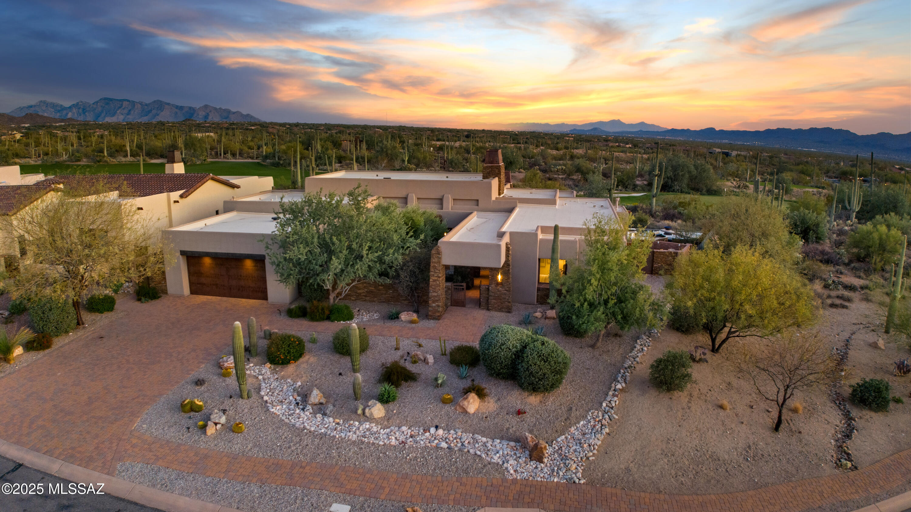 Welcome to The Ritz-Carlton, Dove Mountain. This exquisite home boasts panoramic sunset, mountain, and golf course views, complemented by multiple outdoor living spaces, a negative-edge pool, and a spa.

Inside, the expansive Primary Suite features a brand-new, spa-inspired bathroom, while the Chef's Kitchen is equipped with Sub-Zero & Wolf appliances, a wine fridge, full bar with cooling drawers, and a walk-in pantry. The Great Room is a true showpiece, highlighted by a striking stacked stone fireplace, automated nano doors & screens that seamlessly open to a covered patio with multiple fire features, a full outdoor kitchen, and awe-inspiring views. Owners enjoy exclusive access to The Golf Club at Dove Mountain &  Ritz-Carlton resort amenities, including concierge and home services, curated social events, and more- offering a lifestyle of unparalleled luxury and convenience. Welcome Home!