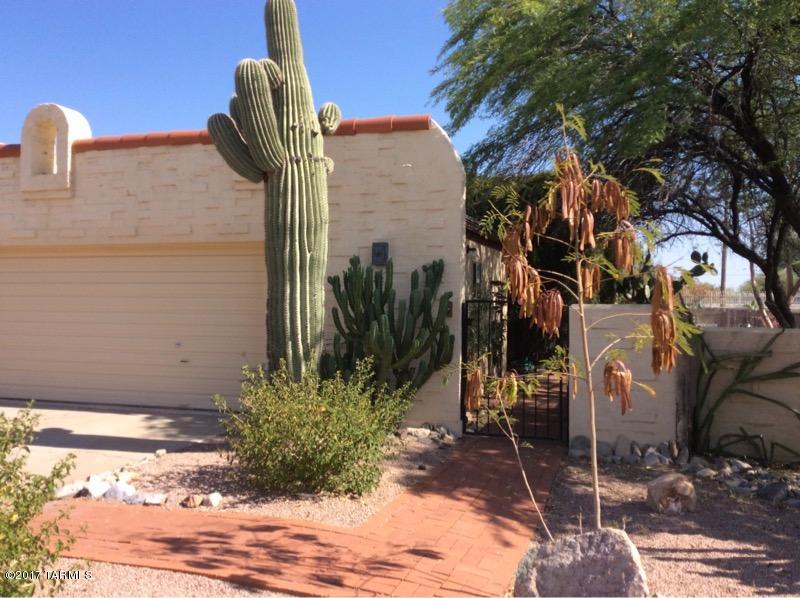 This Sante Fe style town home has been recently renovated and is located near Pima College west campus with easy access to downtown and I-10. Community features  swimming pool, spa, basketball and tennis courts. Saltillo Tile floors through-out, new kitchen appliances, fireplace in the living room, 2 bedrooms plus den/office with private fenced yard located just steps away from the pool access. Epoxy coated 2 car garage with extra storage closets and additional refrigerator!
Rent includes quarterly pest control service.
