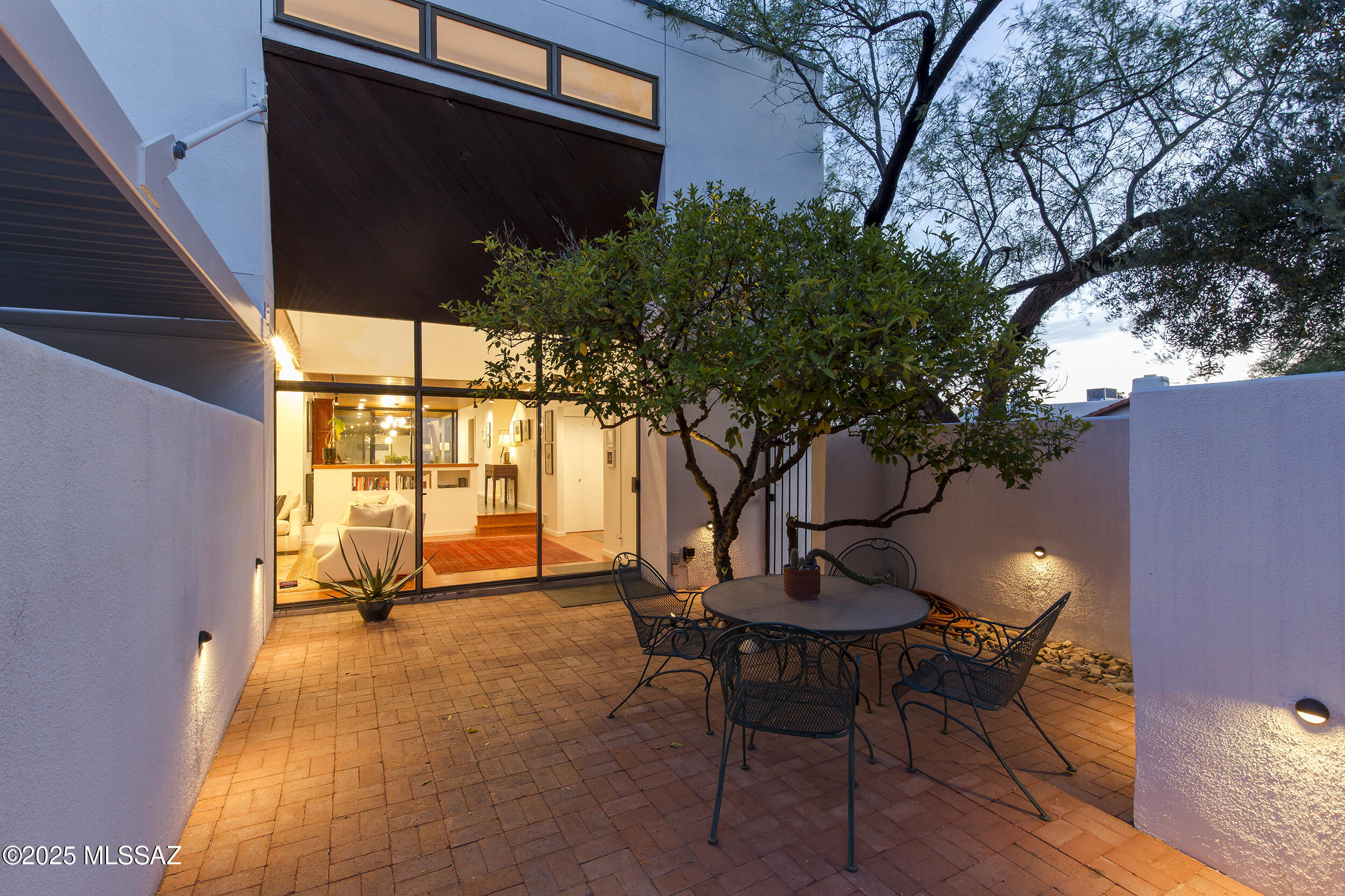 Designed by architect Chuck Albanese, former Dean of the U of A  Architecture. This striking modern residence was thoughtfully designed as his personal home with clean, timeless lines, an abundance of natural light, and exceptional craftsmanship throughout.
Step inside this architectural gem to the living room with vaulted wood plank ceiling, stunning fir hardwood, and slate tile flooring, and a luxurious chef's kitchen with stainless appliances and granite counters. The floor plan allows you to easily step outside through the telescoping glass doors off the dining room, bringing the outside in and the inside out the backyard. The home also features a private front courtyard, creating added privacy.
The current owners have transformed the detached guest quarters into a spacious and serene primary suite, offering ultimate privacy and comfort, ideal for guests, multi-generational living, or a tranquil retreat.
A fully finished basement provides versatile space, perfect for a media room, art studio, home office, or additional family living area. Located in the heart of Sam Hughes, conveniently located to U of A, Downtown, shopping and entertainment.