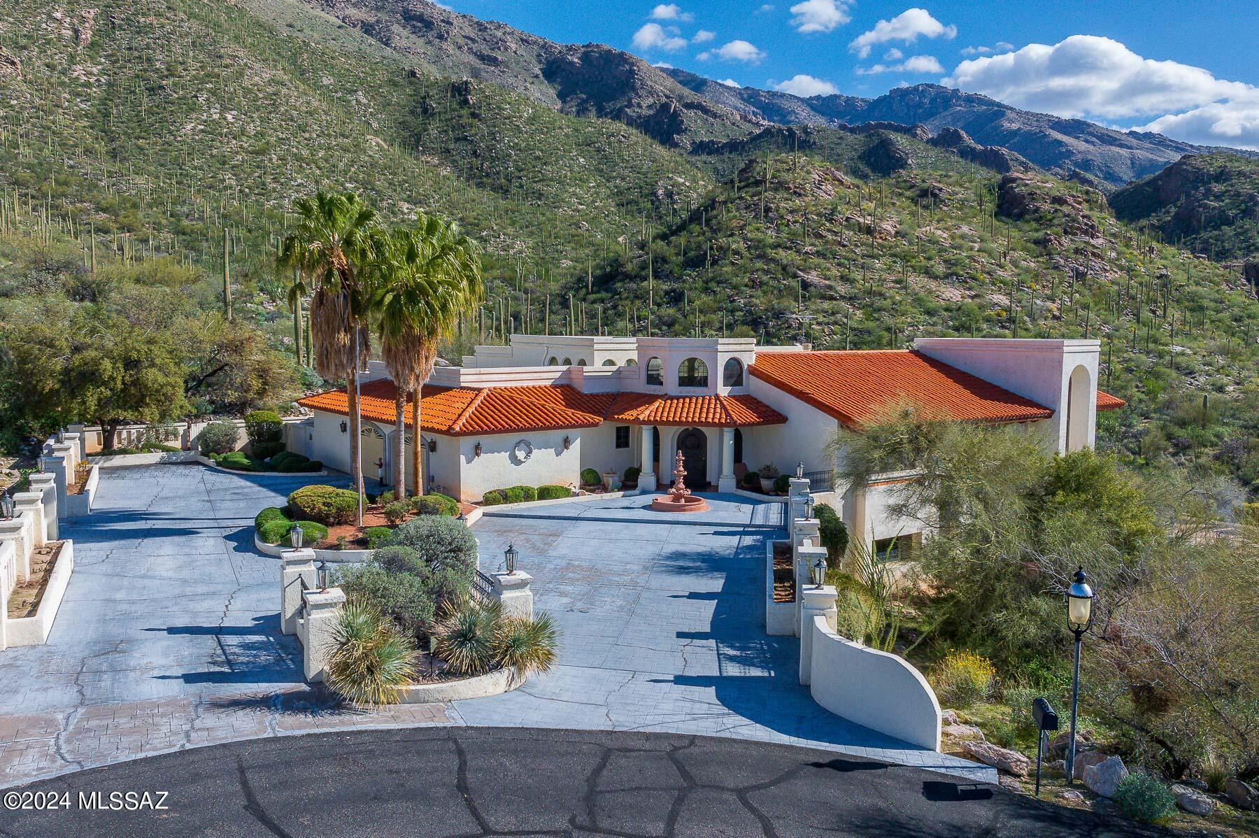 Breathtaking Pictorial Mountain Views, Blanketed with Saguaro Cacti! This trophy estate is situated on a prime lot in the prestigious gated Skyline Country Club! Don't miss this opportunity to own this custom engineered showpiece with over 8000 Square Feet of versatile living space for relaxing and entertainment. Large rooms downstairs can easily be transformed into a home theater, home gym and much more. This home features: Natural stone fireplace, A large chef kitchen, sub-zero refrigerator, Island with prep-sink, water purifier, large walk-in pantry and more than enough storage. Oversized garage has an ultimate, built-in workshop room. Whether, one is entertaining or relaxing by the pool and spa with breathtaking, unobstructed, majestic Mountain views and the soothing ambiance of city views, this remarkable find is rare!