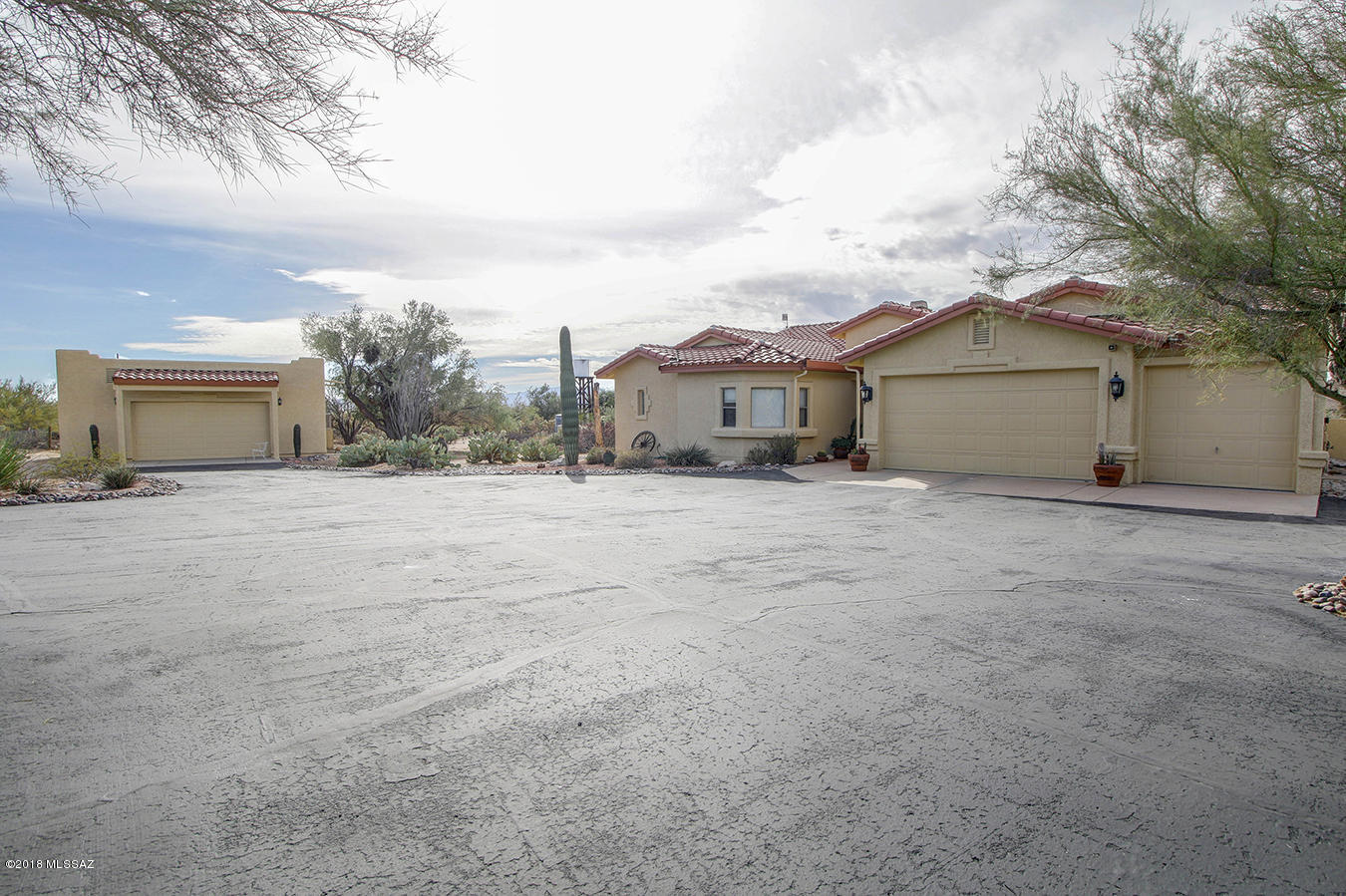 Beautiful Custom Home w Fantastic Mountain Views on 3+ Acres. Enjoy your own private oasis in the desert. Elegant gated entrance w superb curb appeal, lighted desert landscaping & lg fenced area. Gorgeous professionally landscaped walled-in backyard w Pebble Tech pool, soothing waterfall & large elevated covered patio. Newly remodeled gourmet eat-in kitchen with FRESH PAINT, BRAND NEW FLOORING & COUNTERS has bright airy feel, center island & handy computer desk. Cozy family room off kitchen w built in entertainment center & see through fireplace.Lg great room with vaulted ceilings & plant shelves. Open arched formal dining room. Split BR plan has roomy owners suite & large bathroom featuring separate sinks, garden tub & big walk-in closet. Over sized 3 car garage w convenient utility sink.