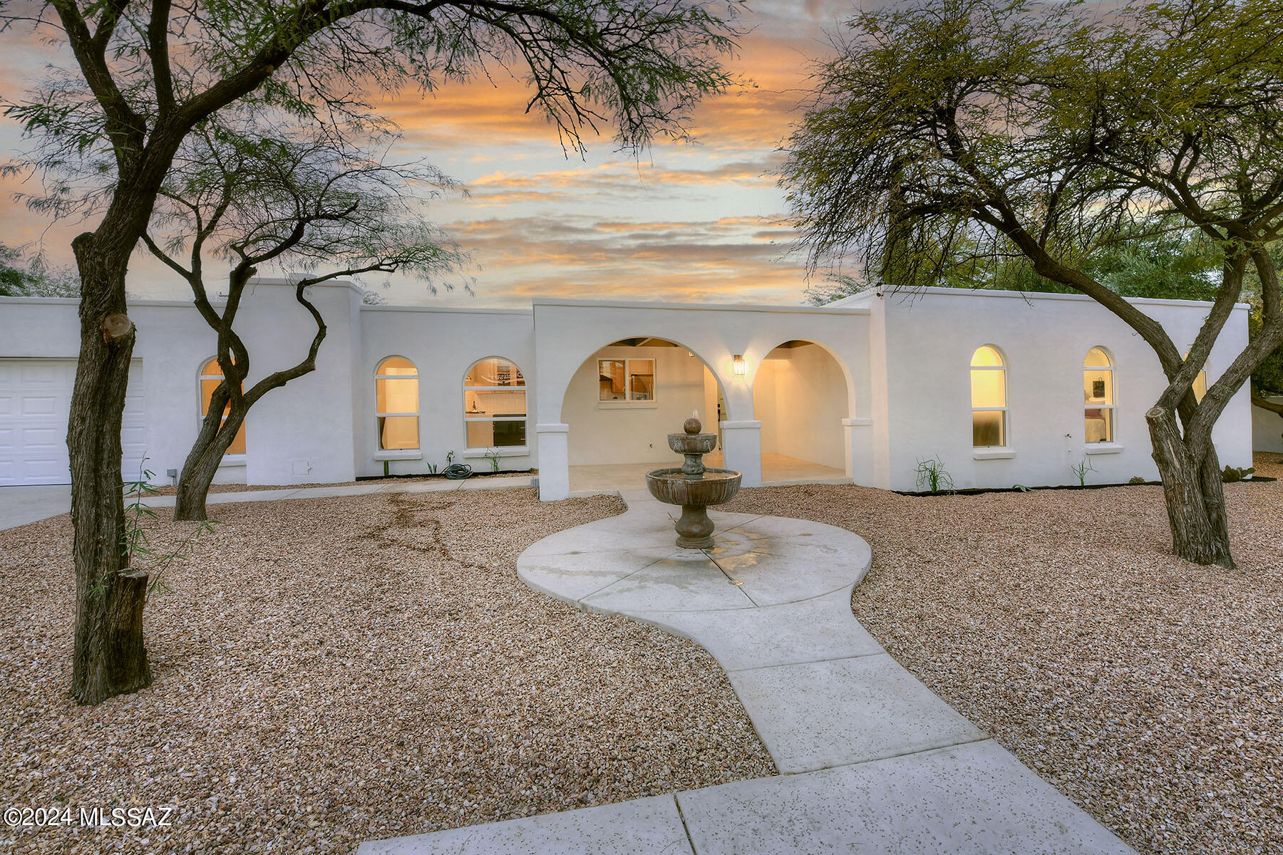Sam Hughes Southwest Contemporary, built in 1975, located near the bike/walking path to the University of Arizona.  Beautifully & impeccably renovated, 4 bedroom & 2.5 bathroom home.  Blonde plank wood flooring throughout living areas. new & ample kitchen cabinetry has tons of storage, quartz counter tops, in this great cook's kitchen, new fixtures & hardware, stainless steel appliances, tiled back splash and includes an eat-in area.  New dual pane windows throughout! New light fixtures throughout. Dining area, sunken living room, French doors to a covered back patio.  Walled and private, large mesquite trees, off street parking, 1 car garage with finished floors, plus electronic gate. walk to Himmel Park, Flora's market and more! Owner is a licensed Realtor in the state of Arizona.