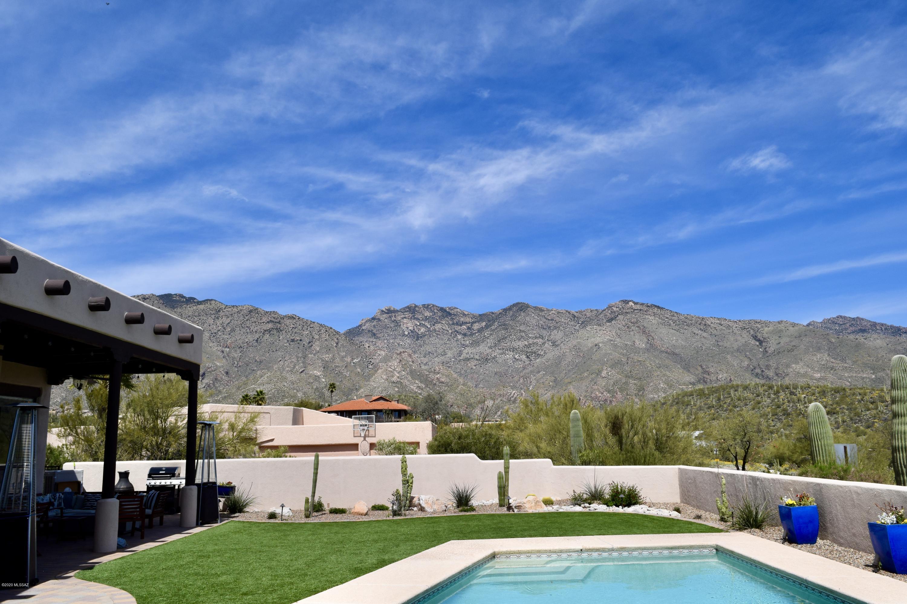 COMPLETELY RENOVATED- This home is unlike any other in the area with spectacular panoramic mountain views from the kitchen and living room in addition to city views from the master bedroom. The property is a 5B 3.5B with a completely open floorplan with walk-in closets and mountain views in EVERY BEDROOM!  A complete remodel was finished in 2018 with countless new amenities including new front doors, wood plank tile flooring,  3 refaced modern fireplaces, sliding 10-foot glass doors entering to the backyard, 12ft ceilings and new lighting,  Other features include a walk-in oversized pantry, an induction stove, and granite countertops. Completely updated bathrooms throughout! Beautiful patio area and backyard with artificial turf overlooking the pool. AND MORE  that won't fit in the character limit here! Sellers related to Listing Agent.
