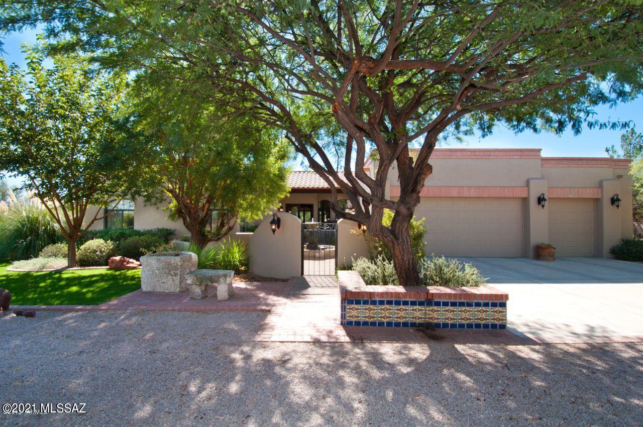 Lovely spacious home in desirable Tubac Country Club Estates.
This four-bedroom home overlooks the 5th fairway of the Otero course. It has a wonderful open floor plan and wide covered porches for easy living and entertaining. It is on a beautiful shady street and has a private registered well. In addition it has a three-car garage and a circular driveway with plenty of parking for guests.