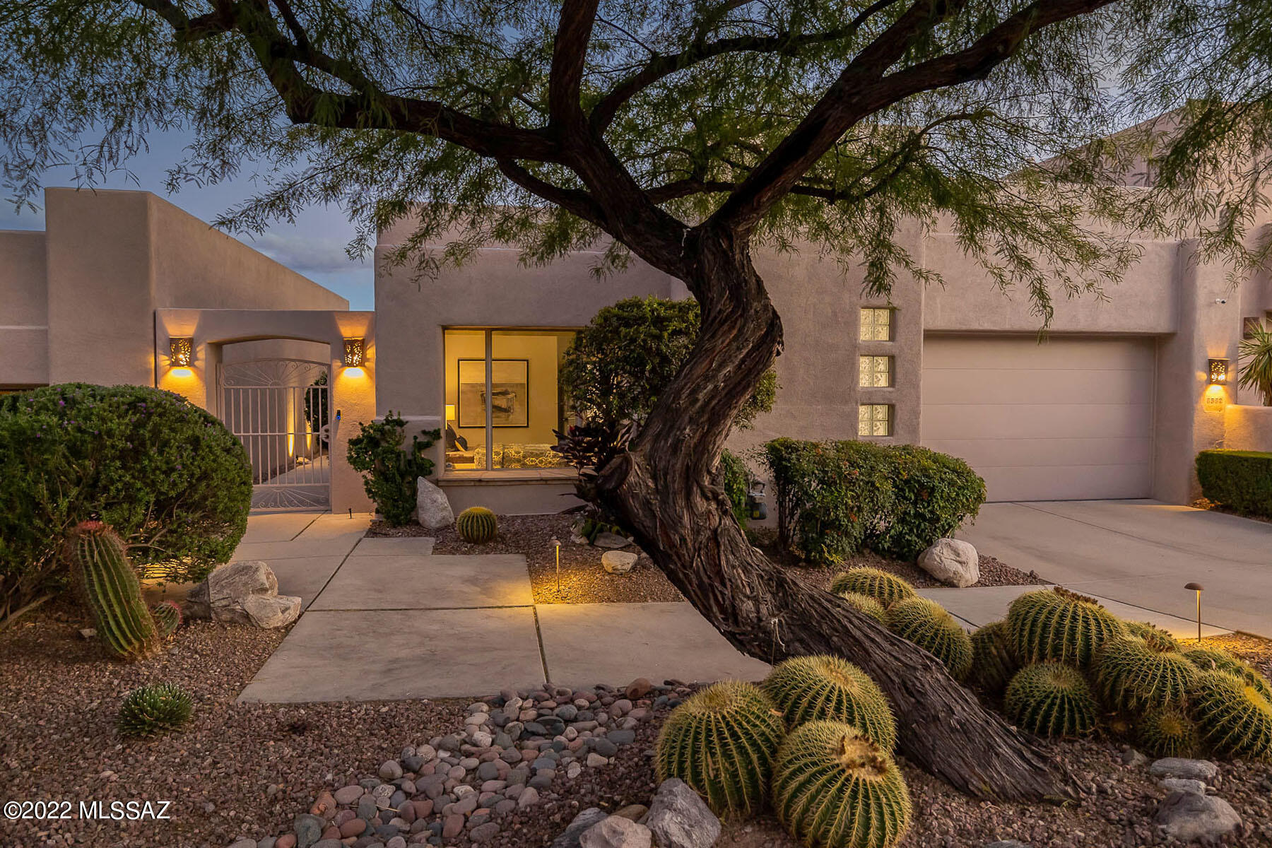 Modern Tucson living at its finest!  Perfectly situated in private, gated & highly sought after The Ridge at Ventana Canyon, this single level David Baird masonry/steel build showcases expansive unobstructed Catalina/Rincon mountain, golf course, & city views, including a unique tee-to-green, ''flyover'' view of Ventana's Canyon #14.  Completely renovated from floor to ceiling with professional designer touches & upgrades throughout, no detail has been overlooked.  This exceptional home offers open concept living, formal and informal dining, motorized shades throughout.  Additional features & upgrades are too numerous to list but include all new Bosch appliances, Cafe Advantium oven, closet by California Closets, new 60'' linear fireplace, new carpet , custom faux paint, new countertops and solar panel power system