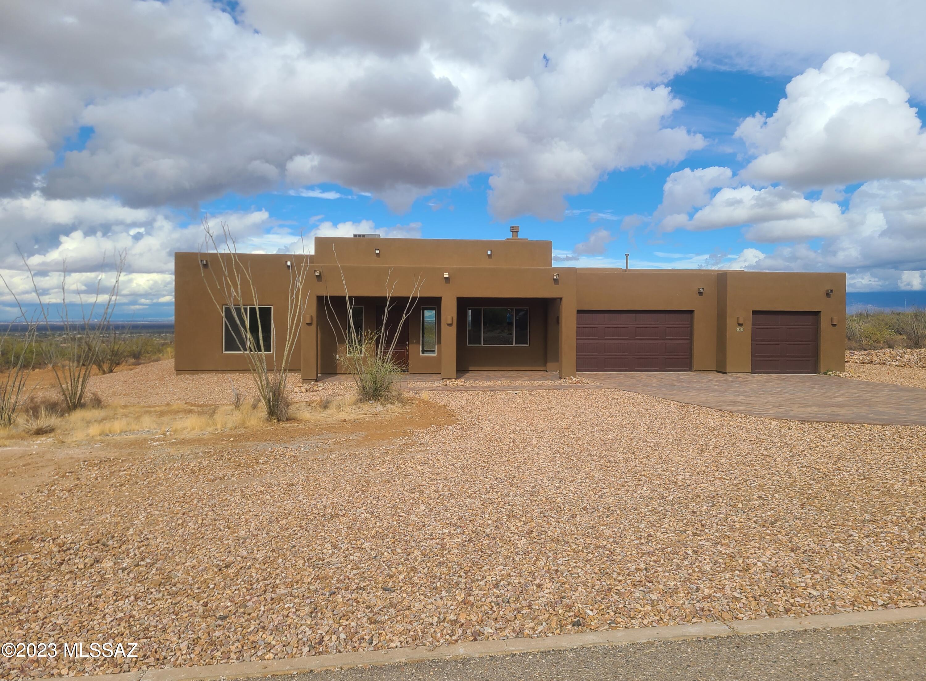 Gorgeous new home on an private 4.1 acre lot nestled in the foothills of the Santa Rita mountains with spectacular views in every direction! 12 foot high ceilings in great room and 10 foot high ceilings throughout the rest of the house. 4 bedrooms & 2 1/2 baths with a separate den/media room. Huge master bedroom with bay window that overlooks the entire valley. Gourmet kitchen with 36'' gas cooktop, double oven/microwave, big pantry, generous cabinet storage & large island with additional cabinets below. Beautiful paver brick driveway leads to an oversized 3 car garage that anyone would love. This one won't likely last long, show it right away!
**SELLER IS OFFERING A $10,000 LANDSCAPING ALLOWANCE WITH AN ACCEPTABLE CONTRACT!