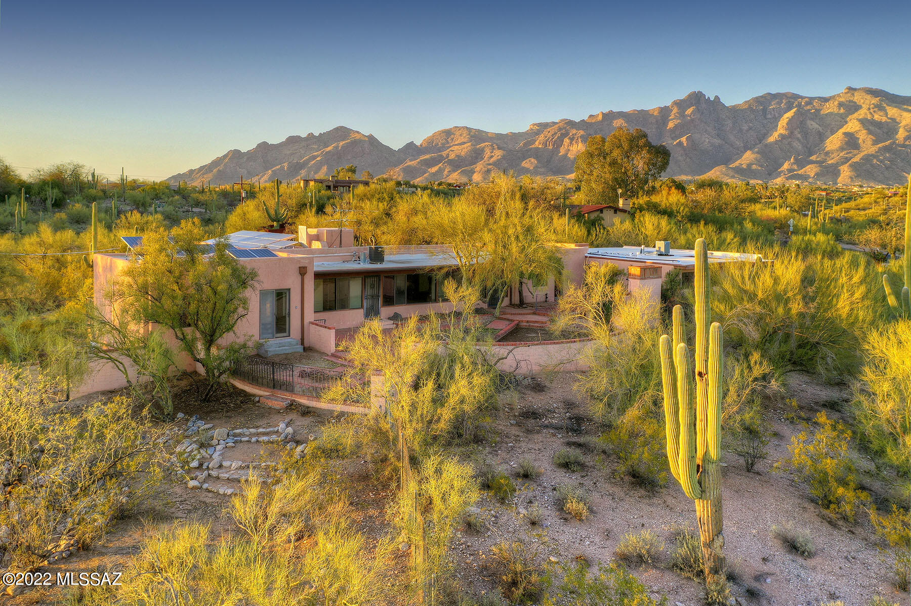 On the market for the first time, the true mid-century straddles the line between old world and new. Set back from the road and sited on over 2.5+ acres in the heart of the Old Foothills is sure to inspire. Guests will be swept up in the stunning views from living, family room and the owners spacious suite. The floor plan opens to gorgeous living room with polished concrete floors accented by warm plank & beam ceilings and stunning fireplace. Owners suite affords privacy, ample closet space, built in shelves in adjoining sitting room and separate entrance. Future owners have space for guest house, a second residence, stables, sport court -you name it - Cr-1 Zoned parcel may be able to be split. Don't miss the guest quarters w/private entrance! Owned Solar Equip conveys as-is.