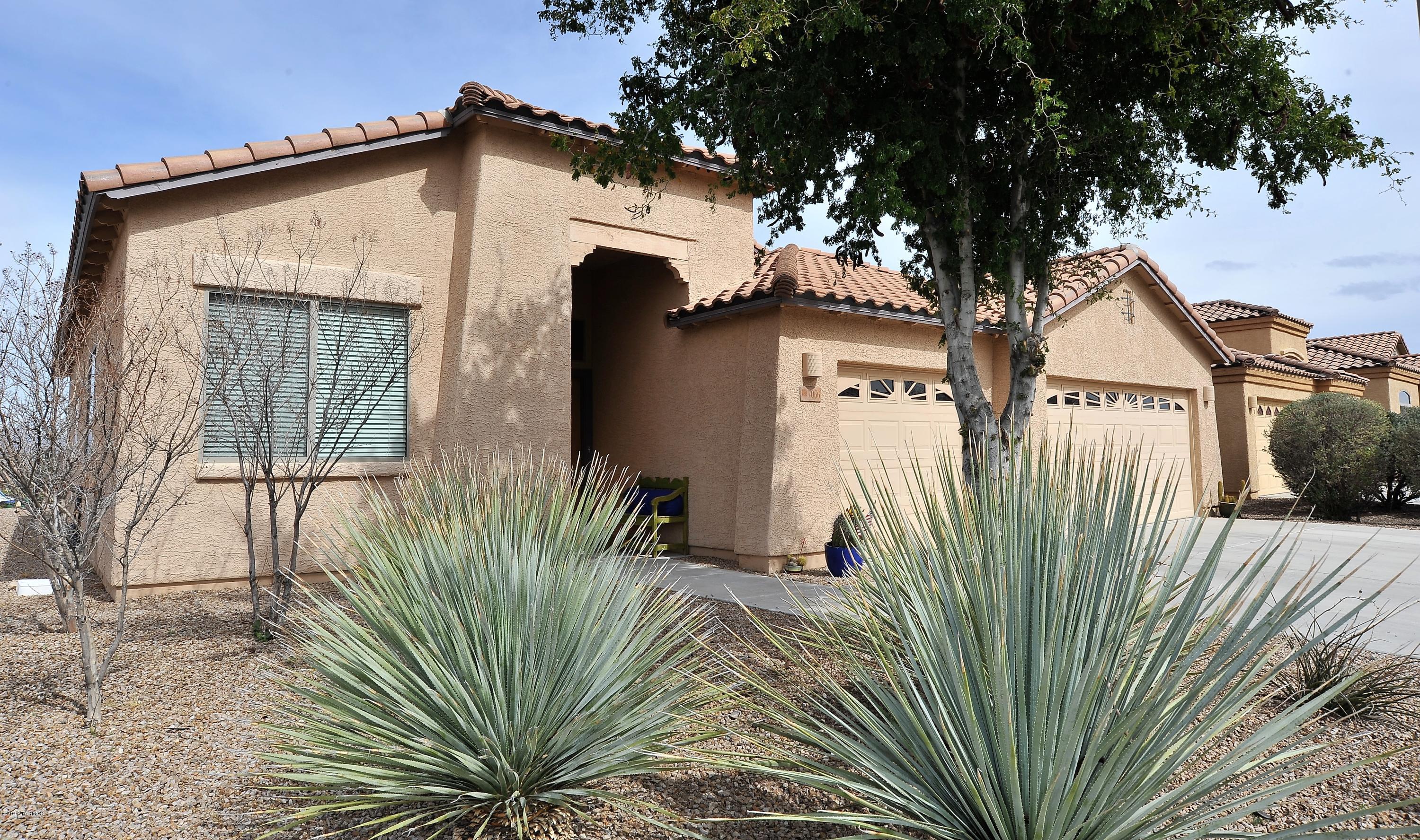 Beautifully done home on premium lot with views!! Slab granite counters, cherry cabinets, kitchen island, built in desk, GAS range, 18x18 tile, water softener system and so much more. Big bedrooms. Separate shower and garden tub in owner's bath. Large backyard with real grass and extended covered patio. Extra attic storage added with pull down ladder in garage.