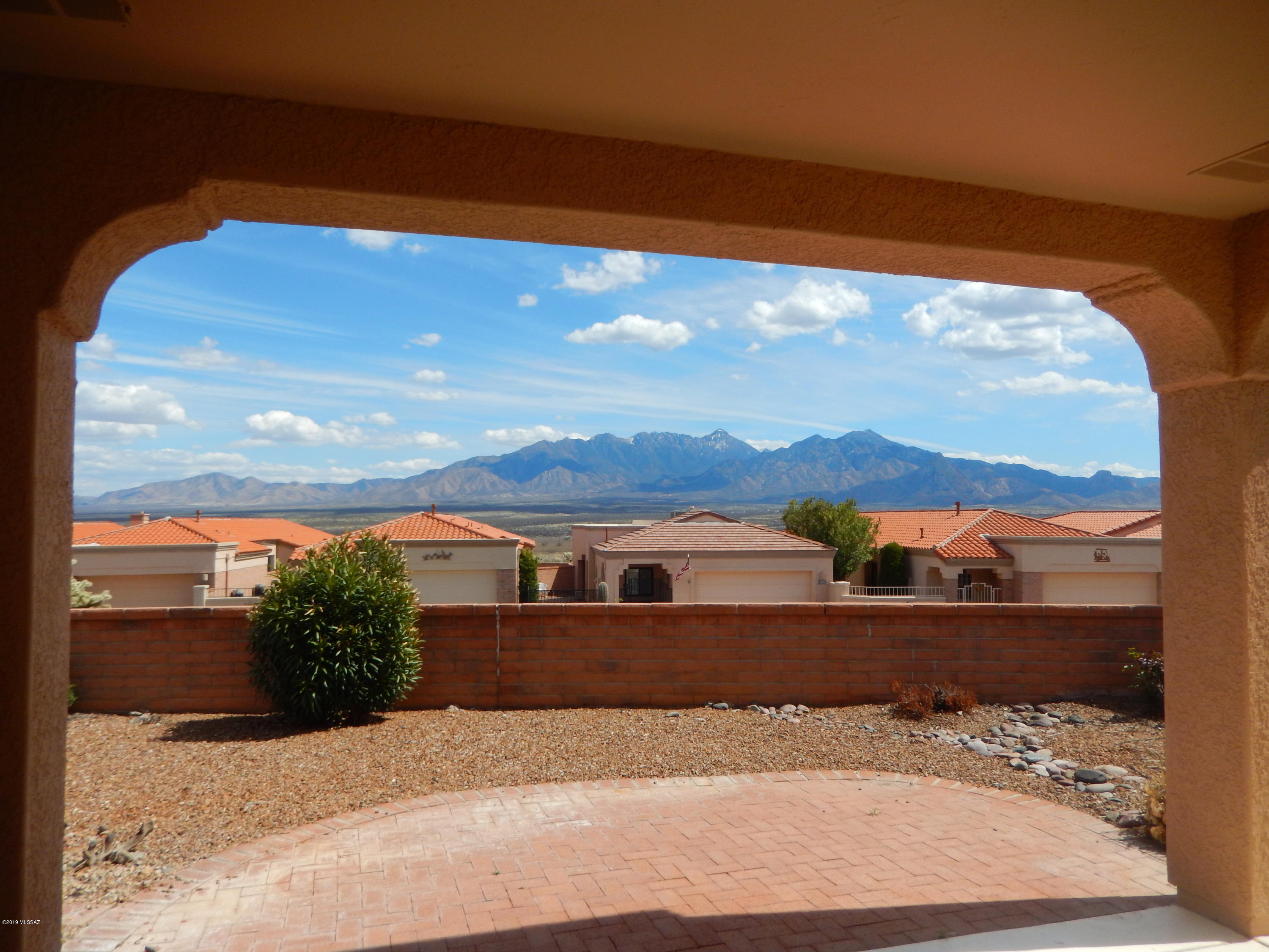 Fantastic mtn. views from the private back patio. 2 Bedroom suites plus living room and family room or den. Very well maintained - HVAC replaced 2017, roof coated 2016 with warranty, and refrigerator 2 years old. Outside and inside living areas painted 3/2019. Most windows replaced. New granite counter tops installed 4/2019. Extra large 2-car garage with room for golf cart.