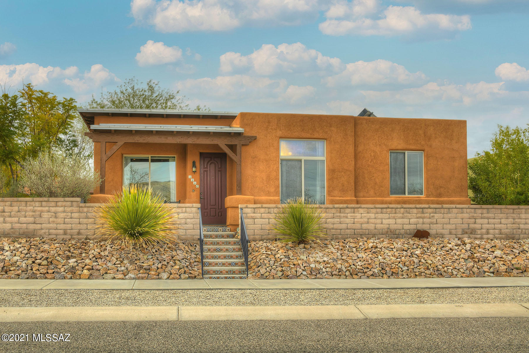 Welcome to Civano, Tucson's unique subdivision with a sense of community.  This SW contemporary 3 BR/ 2 Bath, 1825 sq ft home has it all.  Front door faces East with unobstructed views (no homes will be built across the street). Popular split bedroom plan, kitchen is open to the family room and a separate living room. You will love the high ceilings, kitchen with cherry cabinets, stainless steel appliances and granite counters.  Master bedroom has a walk--in closet, dual sinks, walk-in shower & jetted tub. Enjoy the front & back patios & enclosed yard perfect for reading on the patio or allowing pets outside.  2-car garage with additional driveway parking. Neighborhood features walking paths, parks, nursery, recreation center, basketball & tennis/pickleball courts and (2) community pools.