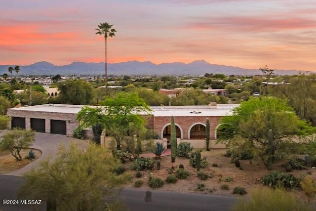 Precisely what you're waiting for. Rarely available - they just don't make 'em like this anymore! The San Luis Burnt Adobe craftsmanship dazzles you w/ unique Tucson charm. Meticulous owners serviced, updated, and/or remodeled nearly everything. Pride of ownership! Guests can dive in to the extra-deep (9') pool or relax by the bubbly Mexican tile fountain, outdoor fireplace, built-in BBQ & grass. High-quality cherrywood cabinets, multi-level island, double-ovens, walk-in pantry, wine fridge, gas Viking range, tons of storage, massive bonus room, mirrored exercise studio, huge laundry room, & water purification system, too. Big walk-ins (2) in the primary BR create the perfect owner's retreat. Privacy, 360° views of the mountains & city lights in Cat. Foothills/Via Entrada). THIS. IS. IT