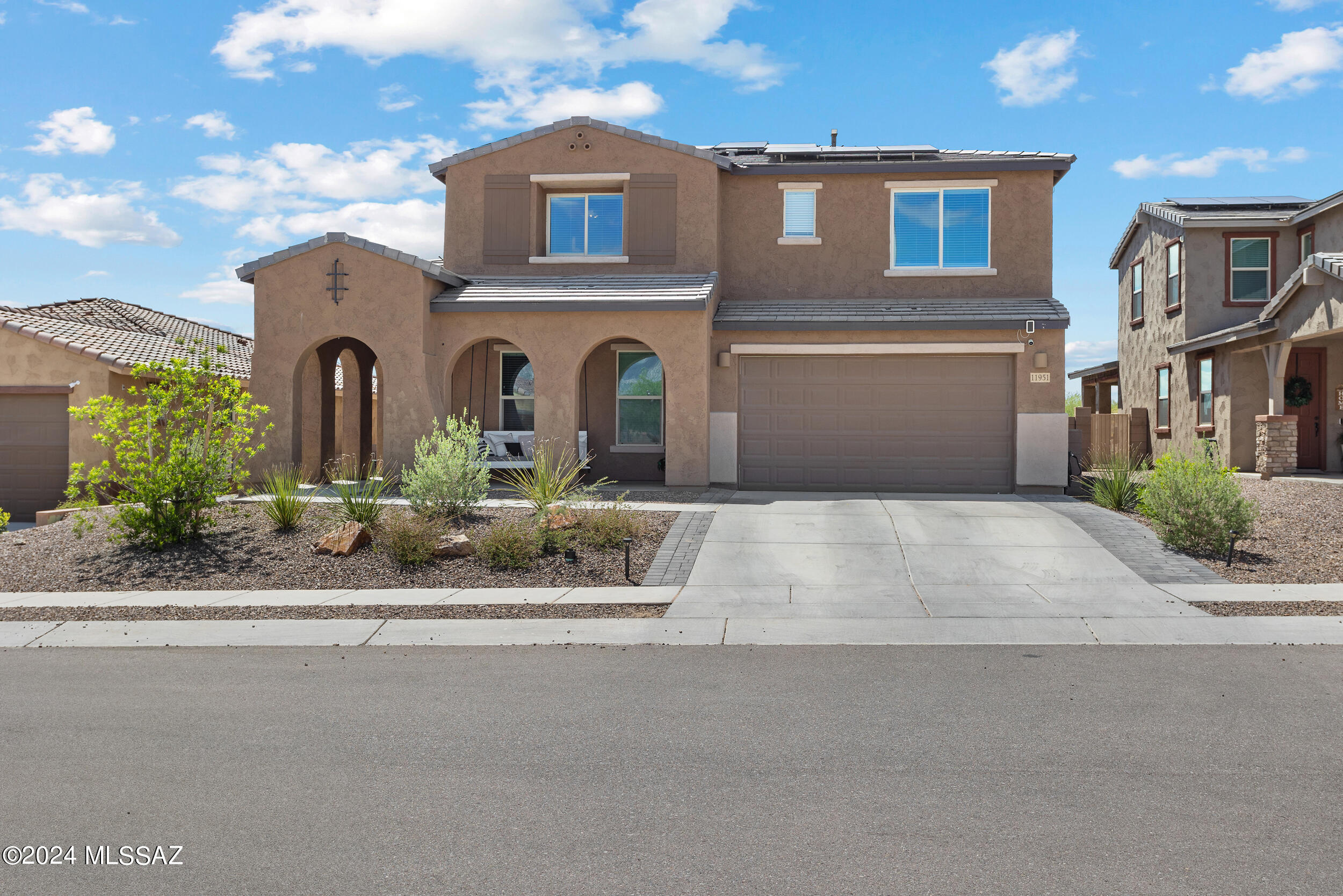 Welcome to your dream gated home in Oro Valley! This stunning property, built in 2022, offers five bedrooms, four and a half baths, and an office space. Down stairs you will find the mother in-law suite and office.

As you enter, you're greeted by an inviting atmosphere with modern finishes. The open-concept floor plan seamlessly connects the living, dining, and kitchen areas, perfect for entertaining guests.

The heart of this home is the gourmet kitchen, equipped with high-end appliances, quartz counter tops, and a large center island.

Retreat to the spacious master suite, complete with a luxurious bath featuring dual vanities and a huge walk-in shower. 
Step outside to your own private oasis, where a new heated pool and hot tub await. Spend sunny days lounging poolside or relax in the soothing waters of the spa. In the evenings, gather around the outdoor gas fire pit.
Conveniently located in Oro Valley, this home offers easy access to shopping, dining, and outdoor recreation. And with a two-car garage providing ample storage space, you'll have room for all your toys and tools.
