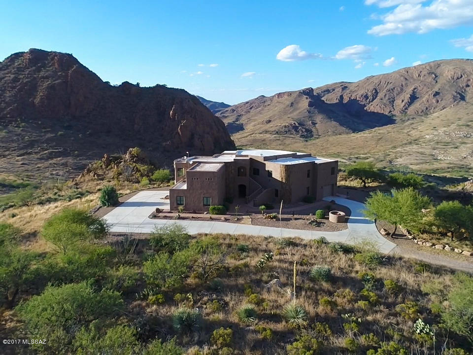 Stunning award winning state of the art truly energy efficient home on 47.52 of the most beautiful acres of the prestigious 20,000 acre Salero Ranch between Tubac and Patagonia. It is built with QuadLock Insulated Concrete Forms on a high mesa at 4,500' elevation. The owners have created an incredible ultra custom home that is built like a fortress with 14.5 inch thick walls. Custom interior features include beautiful travertine tile, maple hardwood floors, solid alder wood custom doors and windows, satin granite counters throughout, custom lighting and top of the line appliances including a rare four oven AGA gas stove. It also has an excellent private well, backup generator, beautiful low care landscaping using grey-water and a lovely breeze way courtyard. The 47 acres backs up to 10,000 acres of conservation open space land that reaches all the way to Patagonia Lake State Park. The views from every room are without question some of the most spectacular on the ranch. Hiking, mountain biking and bird-watching are just a few of the outdoor activities that are daily occurrences with the best annual climate in Arizona. Priced well below replacement costs! Don't miss this one.