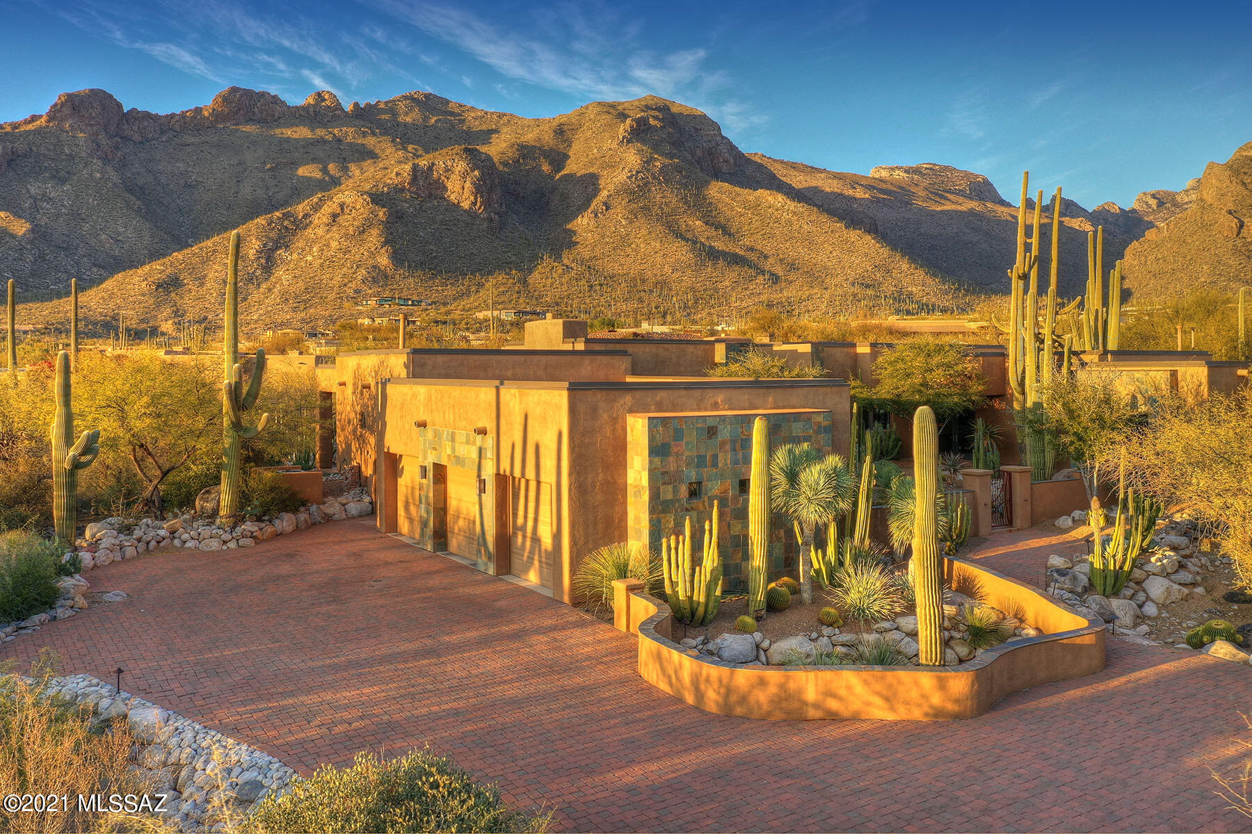 ELEGANCE, WARMTH, PRIVACY & OUTSTANDING MOUNTAIN/ DESERT VISTAS ARE THE HALLMARK OF THIS EXCEPTIONAL PIMA CANYON HOME! CUSTOM BUILT IN 2008 WITH AN INNOVATIVE FLOOR PLAN TO FIT THE LOT TAKING ADVANTAGE OF THE VIEWS OUT OF EVERY WINDOW. CURRENT OWNERS HAVE GREATLY IMPROVED THE LANDSCAPING AND THE EXQUISITE DETAILING OF THE INTERIOR. THE FRAME STUCCO CONSTRUCTION HAS WALLS OF EXTERIOR SLATE DETAILING, PLUS METAL TRIM ON THE PARAPETS. INCREDIBLE LANDSCAPING DESIGNED & INSTALLED BY TOM BLACK. DESERT PLANTS & SPECIMEN CACTI ARE TRULY EXCEPTIONAL . STEVE MACK OF RINGS OF WOOD & DESIGNER, ROCHELLE RUBEN COLLABORATED TO MAKE THE INTERIOR A HAVEN OF SERENITY & COMFORT. THE WOOD BUILT-INS ARE STUNNING. SWIM OR SOAK IN THE POOL/SPA LISTENING TO THE SOOTHING WATERFALL...SEE AMENITY LIST
