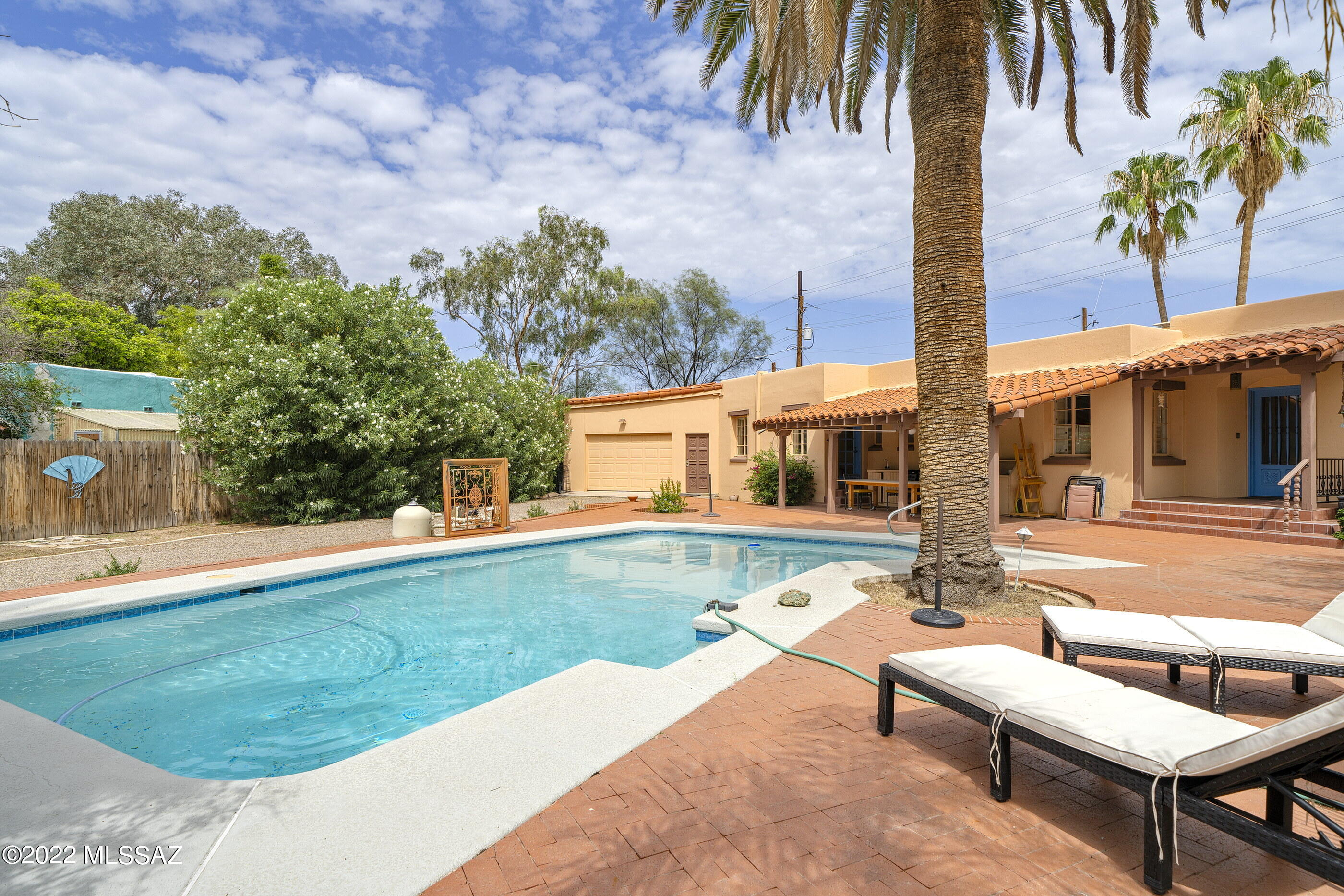 Historic 1938 San Clemente 2683 sq ft home on Calle El Centro w an 1167 sq foot in home office. The main house has vintage charm w hardwood floors, 2 large fireplaces, beamed ceilings, multiple built in cabinets w shelves, a darling kitchen w 5 burner gas stove & a utility basement w wall safe! The huge back yard has extensive paved entertaining area, a large swimming pool, covered patio & mature landscaping & RV space. Two 2 car garages on either side of the house & one carport space offers plenty of covered parking & hobby space. One of the garages has a half bath! The 5 room 1167 sq ft office w half bath, formerly a medical practice, is a perfect in home business & is a quiet buffer b/n Broadway & the main home. Convert into a Mother In Law suite?! Extensive Roof Work done in 2021.