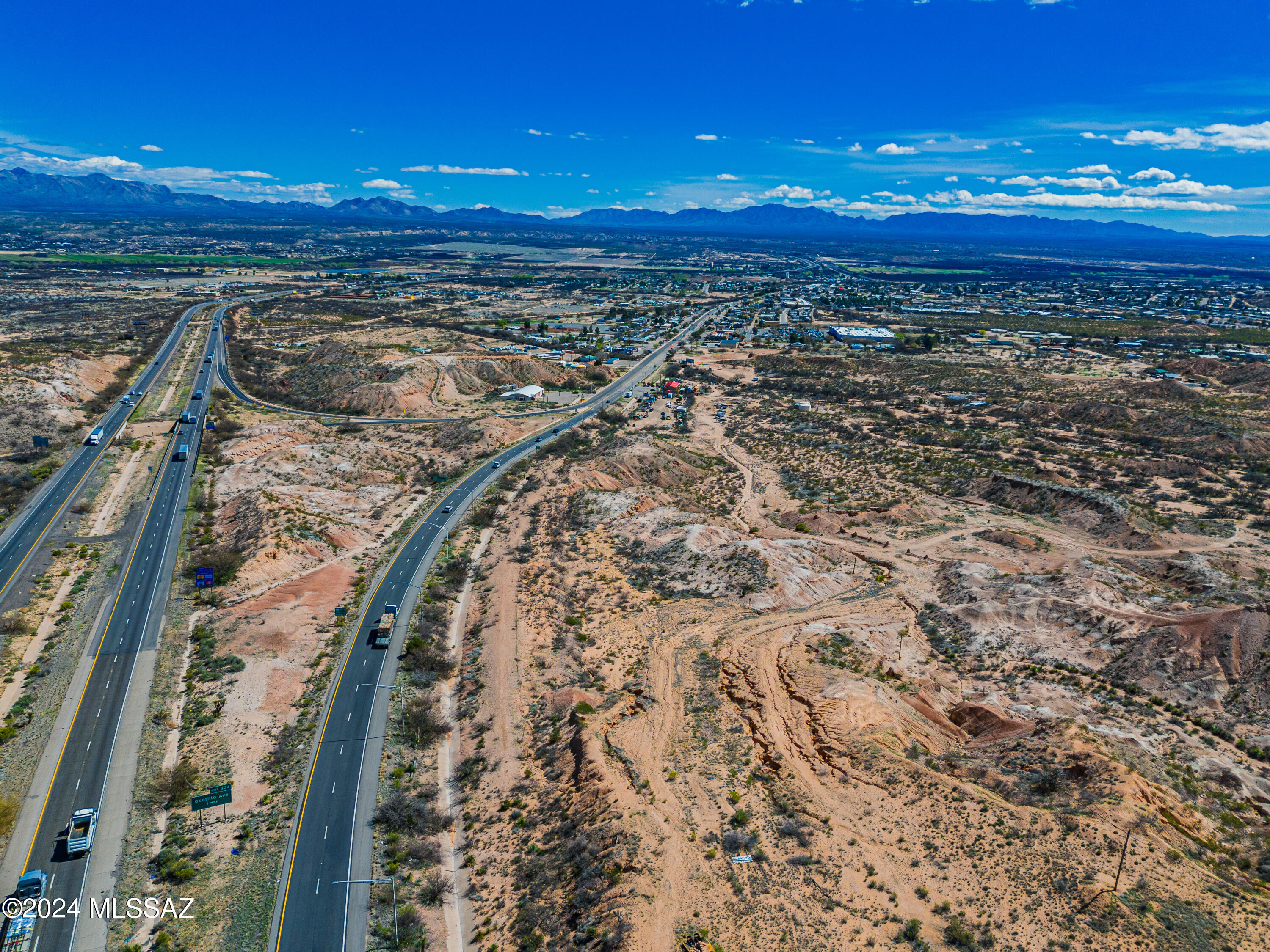 5 Parcels Total The first driveway/curb access off I-10 exit. Prime location. Visible from I-10. 30.67 Acres Zoned B-2 Commercial and one zoned ''Rural Transitional'' All city utilities readily available. Close to Walmart. Great Size: Large enough for commercial operation or complex. High Traffic Volume on main road and I-10 high Volume. Good Water Supply. Benson main street location and easy commute to Tucson, Tombstone, and Sierra Vista. Potential Uses: Factory Outlet Shopping Center, ''Big Box'' Store, Motels and Restaurants, Commercial Business Park, Large Semi Truck, RV Park, Mobile Home Park, Manufactured Home, or Residences, Automotive Truck Travel Center, Service Mall, Municipal/Government Office Complex. More Photos and Aerial coming soon. Individual Parcel(s) sales POSSIBLE.