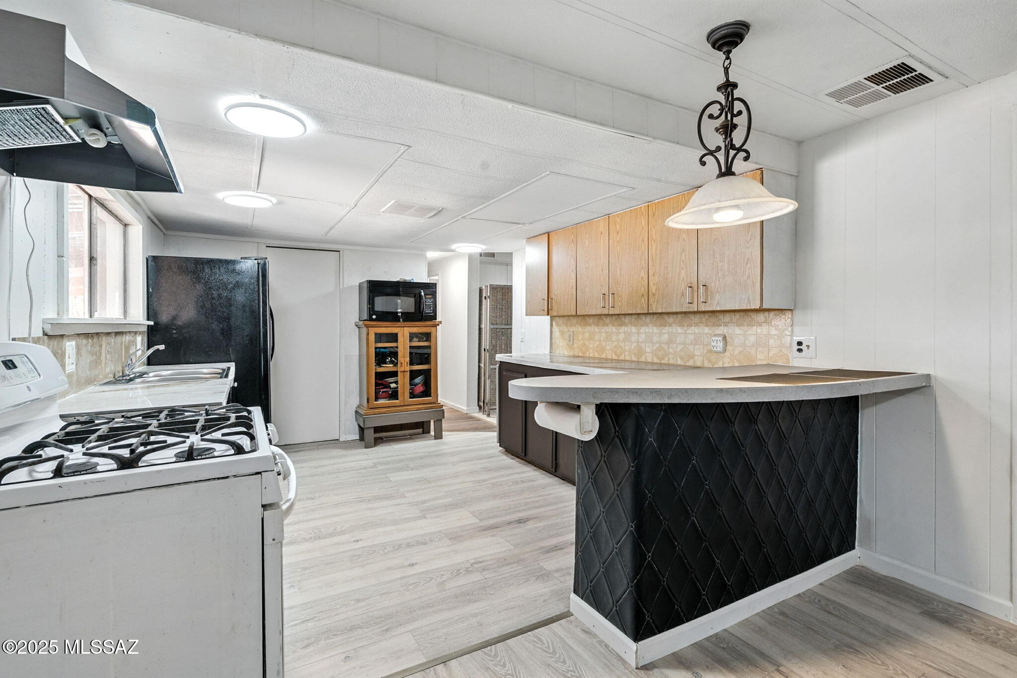 Welcome to your peaceful desert retreat! This 3-bedroom, 2-bath manufactured home with an extra AZ room and office space, nestled on over a one-acre lot, offers both serenity and space—rare to find so close to Tucson. Enjoy the advantage of no HOA, giving you the freedom to personalize outdoor spaces, or park your RV or toys.