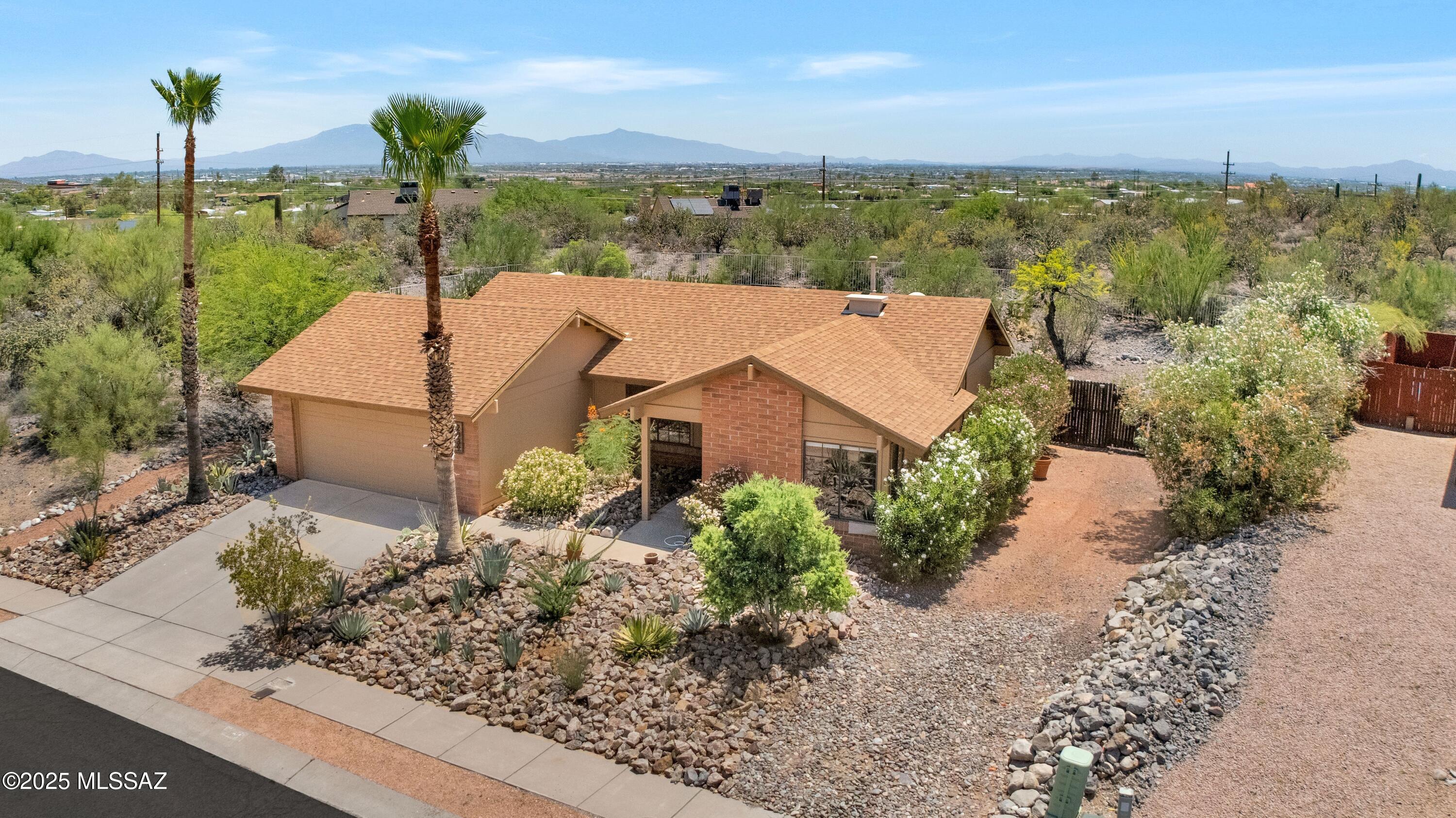 Fabulous light filled 3 bedroom 2 bath home in Park West in move in condition! This darling home sits on a huge .21 acre lot that is private & quiet with easy care desert landscape. Smart split floorplan affords privacy & comfort. Great flow of space between kitchen & living room. Ceramic tile throughout with neutral carpet in the bedrooms, plus ceiling fans where they matter. Tastefully & freshly painted exterior & newer shingle roof brings confidence to any buyer. Huge lot affords privacy & opportunity for a pool &/or spa, raised bed gardening, etc. Convenient location to downtown Tucson, Mercado District for an evening drink, 5 min to I10, 5 min to Tumamoc, 15 min to UA. Location is ideal to feel separated from the frenzy of city life yet within minutes of engaging. This won't last!