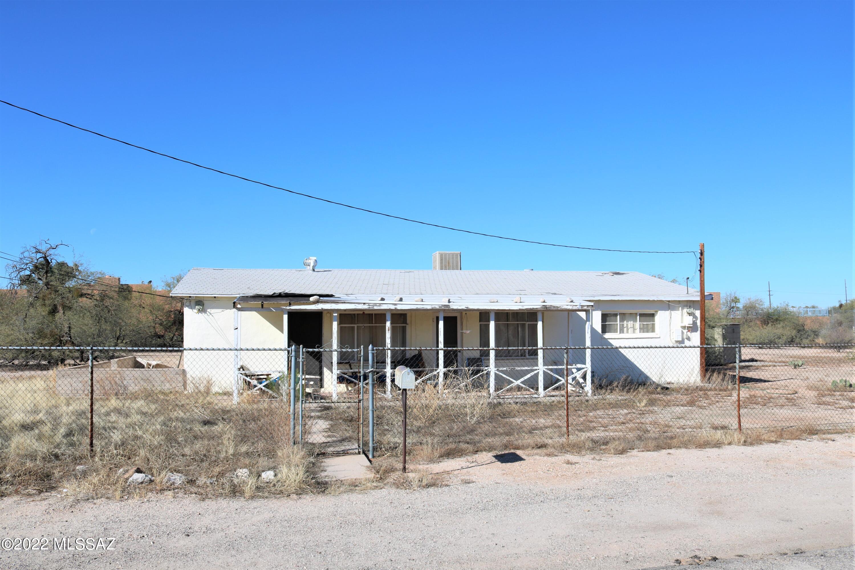 The value is in the land!  Huge R-2 lot, with 1948 extreme fixup home.  Perfect for investors/developers! Investigate with Dev Svs what might be possible on this 1.12 acre lot, zoned R-2.  SFR's, a pair of duplexes, rental casitas?  Last parcel at the end of Estrella Lane.  Property is fenced, cleared but for the house.  Surrounded by newer townhome communities, rental developments,  and neat tidy vintage houses on Estrella Ln.  Close to many amenities such as Tucson Mall, the Loop, and restaurants and fast food.  Great opportunity here.