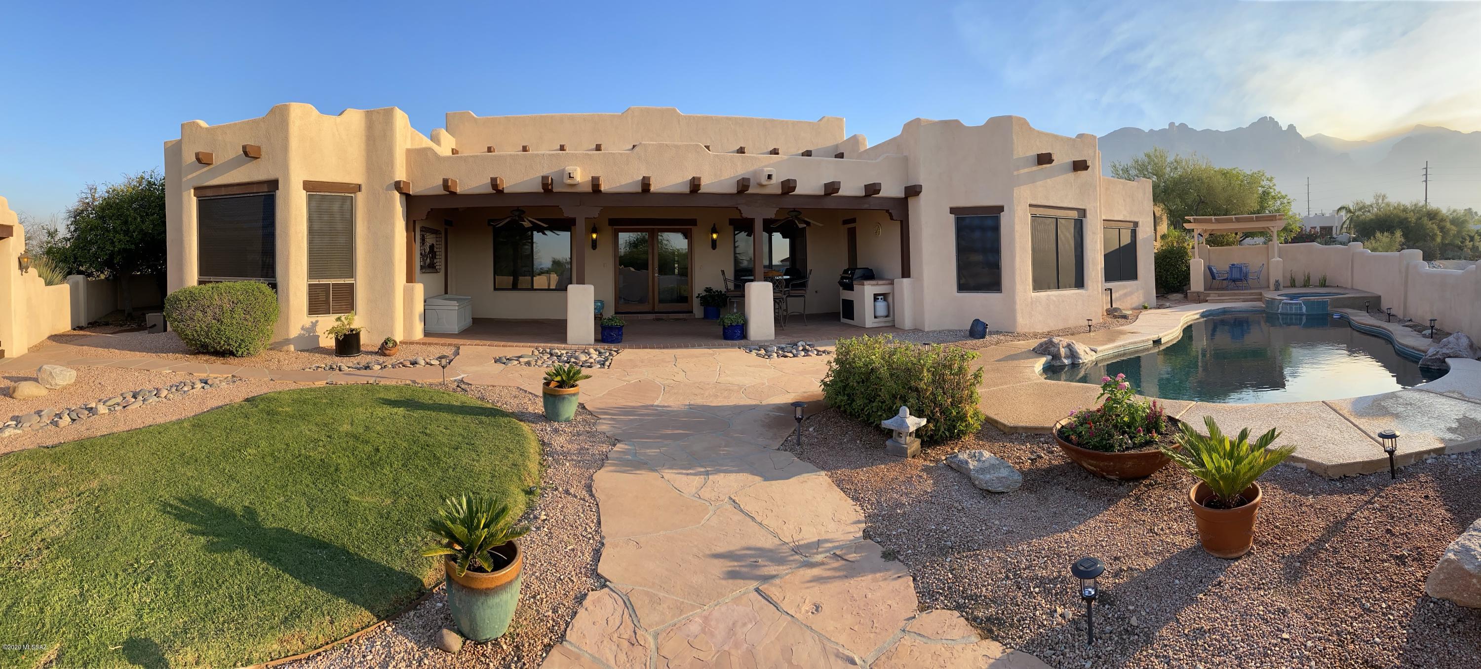 An amazing premium Fthls property with awesome mtn, city and sunset views. One of the nicest large lot in a small private cul-de-sac. Entering the long driveway to a private courtyard entry. Bright and spacious living and dining rooms with vaulted wood beamed ceilings. Gourmet kitchen has a large island and granite counter tops.Large breakfast area with bay windows. Fam rm with fireplace and blt-ins perfect for family gatherings. The resort like backyard comes with pebble tec pool, spa, beehive FP and elevated ramada for panoramic city & mtn views. The master BR has extra area for exercise, nursery or study. The extra large 4th BR with blt-in shelves,desks and wall bed. Alder doors throughout.One of the owners has license to sell real estate in the State of AZ. One of the owners has license to sell real estate in the State of Arizona.