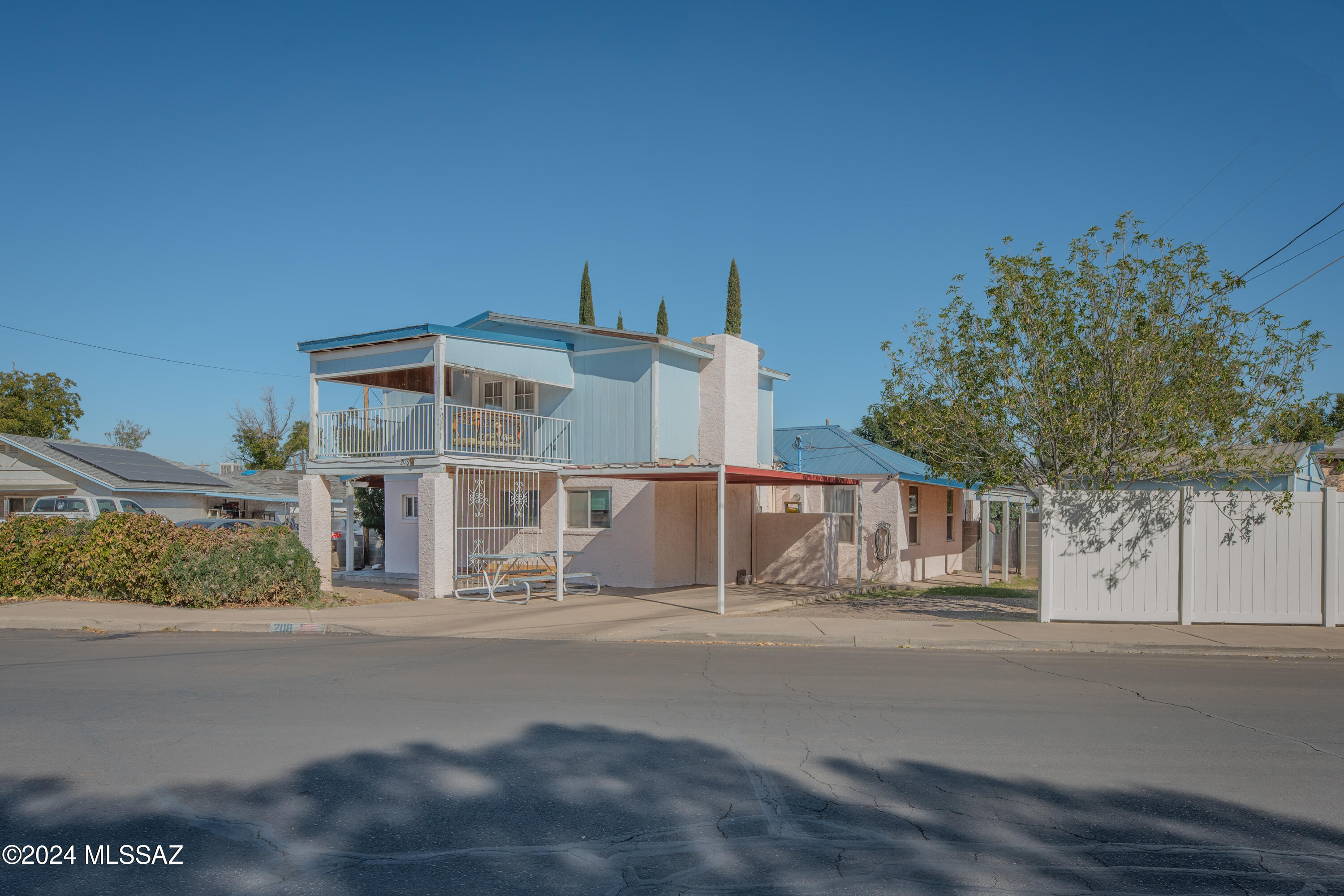 Here's a property that offers both potential and value. This 4-bed, 2-bath home, spanning 2,000 sqft. is situated on a 0.15-acre lot in the heart of town.
The home is encompassed by a sturdy block wall and a convenient carport. It features a solid indoor fireplace, an outdoor pool which includes an automatic skimmer system accompanied by a poolside pavilion. The pool requires a new liner and some TLC to restore it to proper working condition. The upstairs is a room primed for your personal finishing touches with a covered balcony with a great view of Mt. Graham, two walk-in closets (one can be converted into an additional bathroom). The home also includes a storage room and a shed. One of the bathrooms features a newly installed shower that needs a few final touches to complete.