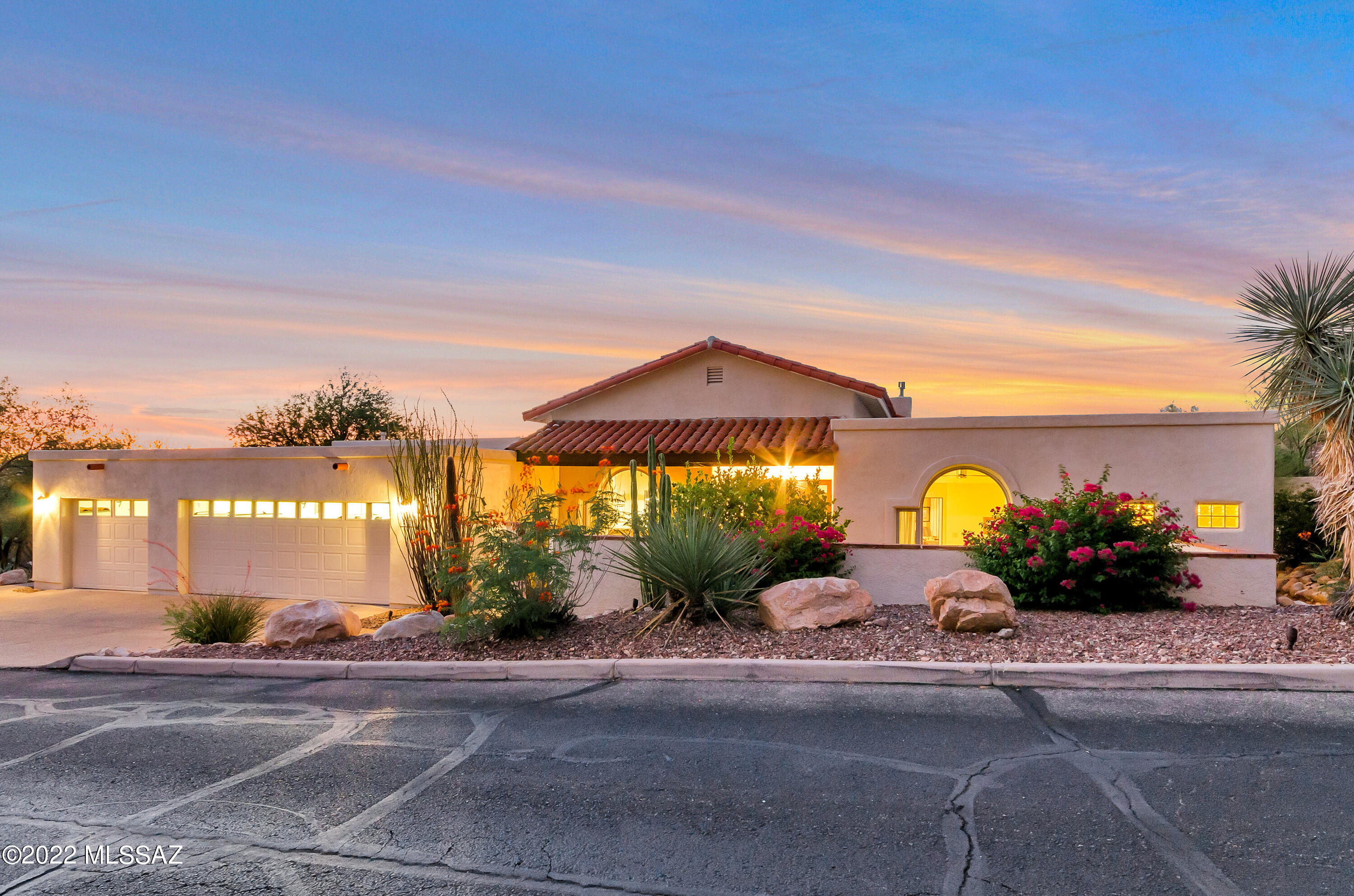 Magnificent Mountain & City views!  Tranquil retreat is located in the prestigious gated community of Wilderness III at La Reserve.  Follow the brick path through the courtyard to double entry doors & grand great room!  High ceilings, beautiful travertine floors, new modern lighting throughout & an inviting open floor plan w/split master suite!  A wall of windows draws your attention to the sparkling pool, w/spillway from elevated spa. 
Cov'd patio enjoys the stunning desert vistas.  Private large lot. Gourmet kitchen w/impressive Quartz island has abundant space for entertaining. Sit at the bar for a snack, charming bkfst nook or dine in formal space. Pendant lighting, prep sink, beverage frig plus gas stove w/hot water arm.  Appliances finished w/the same custom woodwork as the cabinets