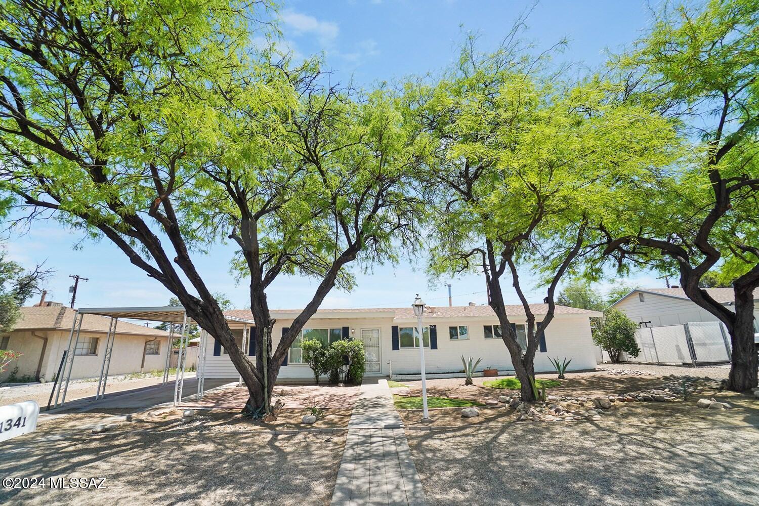 Gorgeous Large Home with two master bedrooms and bathrooms.  Large Family Room with Fireplace.  Separate Office with Outside Entrance.  Fully remodeled with ceramic floor tile, new a/c units, new kitchen and bathrooms.  Large park just around the corner.