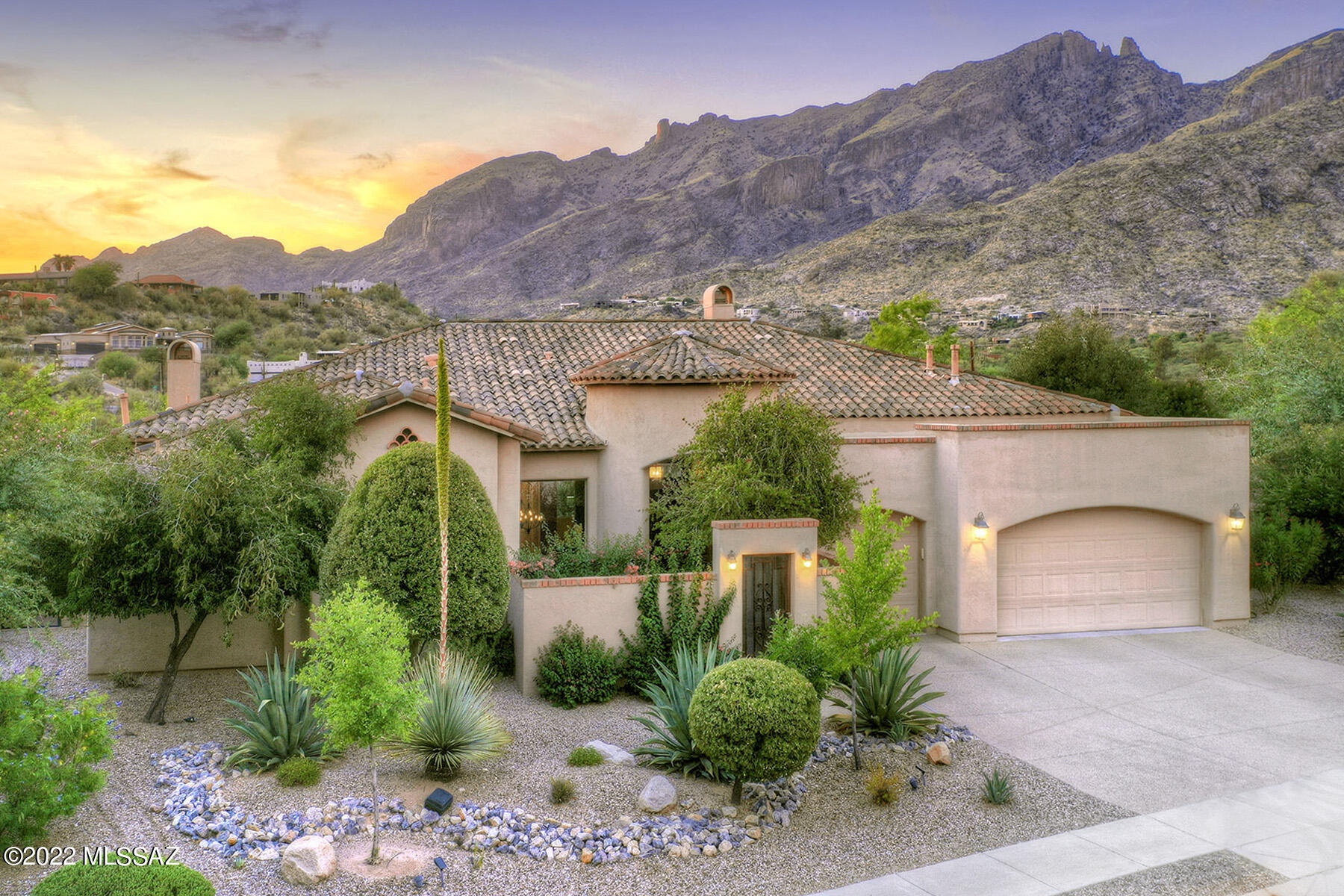 Stunning soft contemporary w/sensational mtn views in prestigious gated community of Paloma Canyon. Charming front gated courtyard w/lush landscaping, exquisite liv room w/dramatic high ceilings, walls of lg picture windows capture the view, frplc w/stone hearth, formal dining rm w/built-ins, gourmet island kitchen w/granite countertops, stainless steel appliances, gas stove top, refrigerator, breakfast area, pantry, fam room w/frplc,  gorgeous natural stone flrs, 4 bedrooms, 4 baths, lg master w/sitting area, 2 walk-in closets, lux bath w/marble countertops & marble flrs, jetted tub, laund rm w/ washer & dryer & 3 car garage. Enjoy the fabulous expansive bkyd w/covered patio, gas heated pool, spa, water feature, grass, basketball court, BBQ, Dist 16 schls & magnificent mtn views.