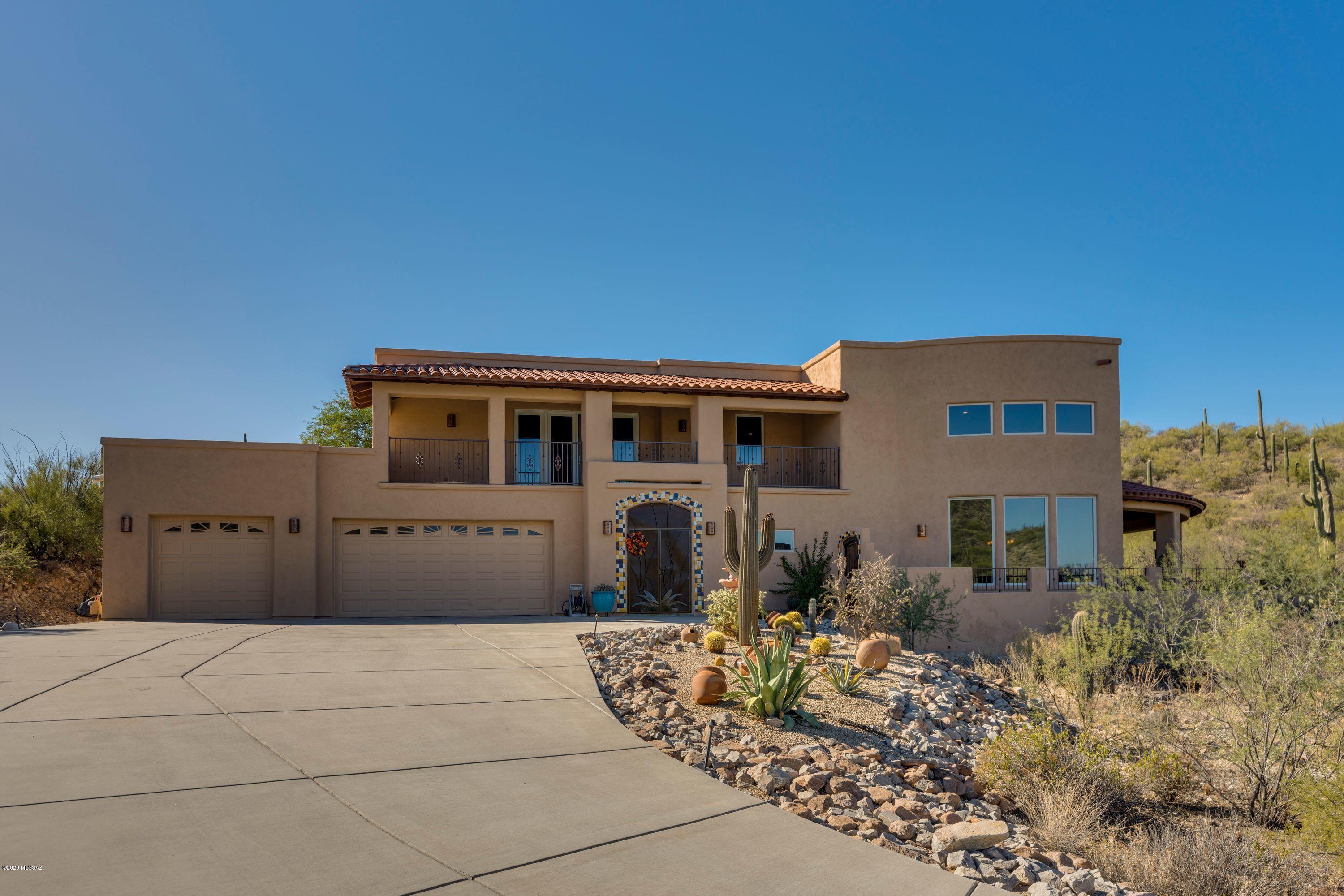 Amazing custom Home located on acre plus lot in Starr Pass. The city and mountain views are almost in the home with you. Enter thru the court yard and prepare yourself. Features 3 bedrooms and 2 offices. Office on second floor is plumbed for additional Bath. We have Zone cooling, dual zone hot water heaters, Ceiling fans, Fire suppression system, water softener 3 car garage very private lot.  Enormous Butler pantry. Huge greatroom plan with large windows to grab the views. Kitchen features large island, Sub Zero refrigerator Alder wood cabinets, doors and trim throughout the home So much more.