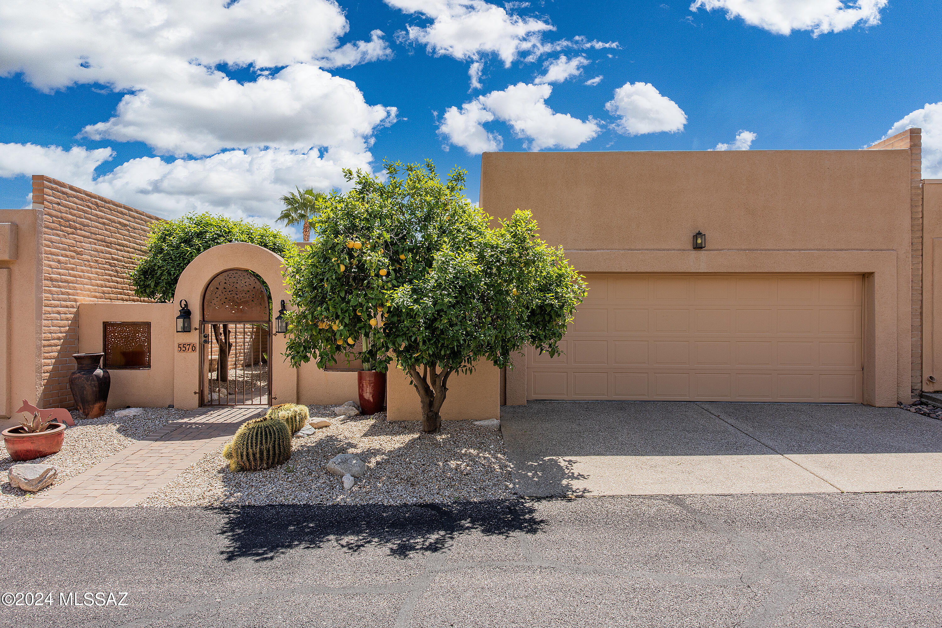 GORGEOUS 3 bedroom + office patio home in LOVELY FINISTERRA! Enter cobblestone streets to one of the MOST CHARMING & DESIRABLE GATED (24/7) Foothills communities! With STUNNING VIEWS from every window, this exceptional, RARE GEM has a quality & warmth that captivates your heart! With high ceilings & grand clerestory windows, light & mountain views shine through! From the delightful, citrus filled gated front courtyard to the spacious, welcoming foyer & large living room, this home radiates elegance & style. Rich wood floors, walls of windows & gas fireplace create the ultimate luxurious feel! Dazzling white GOURMET KITCHEN w/ ss appliances, granite counters, gas stove, large walk-in pantry & ideal eat-in area! Laundry rm w/ newer washer/dryer. NICELY UPDATED, ALL ONE LEVEL~SIMPLY PERFECT! Primary bath overlooking the city has travertine floors, jetted tub & walk-in shower. Perfect office/study off the kitchen! Absolutely wonderful, IDEAL FLOOR PLAN! Private, low maintenance terraced backyard w/covered patio, raised, in ground spa, artificial grass & built in bbq. Incredibly PRIVATE with sweeping CITY VIEWS! SO MANY COMMUNITY AMENITIES: Clubhouse, heated pool/spa, tennis/pickleball, a social club/gatherings, yoga & hiking!