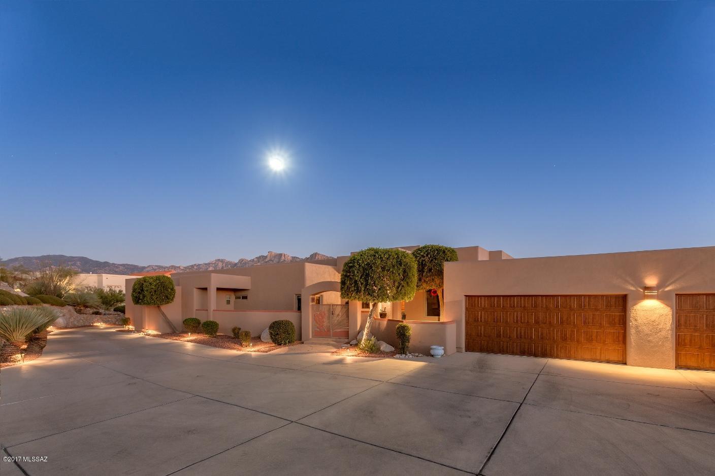 Canada Hills Estates...Great Location on the 9th Fairway of the El Conquistador Country Club...Stunning Views of Pusch Ridge and the Catalina Mountains. Custom designed home by architect Gary Robison. 3 Bedrooms, 3.5 Baths, plus professionally designed home office with built-in desk and cabinets. Split floor plan with Master Bedroom Suite. Great Room with high ceilings, lots of glass, and beehive fireplace. Gourmet Kitchen w/ gas cook top, granite counter tops, and marble tile floors. Covered Patio with ''Turbo'' built-in BBQ. Pebble Sheen heated Pool and Spa with flagstone decking. Large 3 car garage with Polymer floor coating. Home is immaculate throughout and a pleasure to view. See Owner's Remarks and Floor Plan under ''Documents''