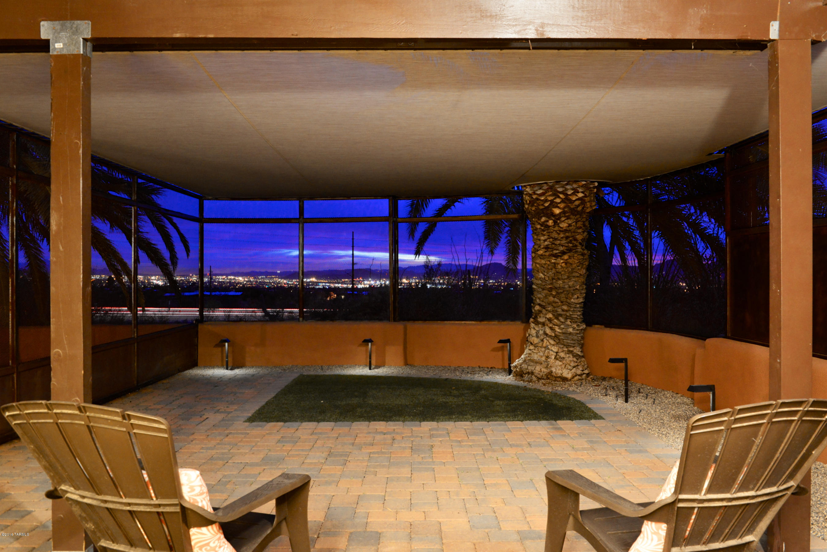 Welcome home to this private Foothills property on 1+ Acres.  This burnt adobe home has been thoughtfully updated: premium 4' ceramic tile, new windows & sliders in living/dining, kitchen & laundry.  Kitchen features Kraft Maid cabs, w/pullouts & soft close drawers, R/O system, granite, double sinks, walk in pantry, and SS fridge. Open living/dining features loads of windows to capture the fabulous views! The wood burning fireplace is dressed up with a new wood mantle.  Master & hall bathrooms feature new vanities & lighting. Laundry room with loads of storage shelves. Enclosed patio area great for pets, children or just enjoying the wonderful sunsets & city lights!  A 2 car carport & 1 car garage give you plenty of storage. Too many upgrades to list!