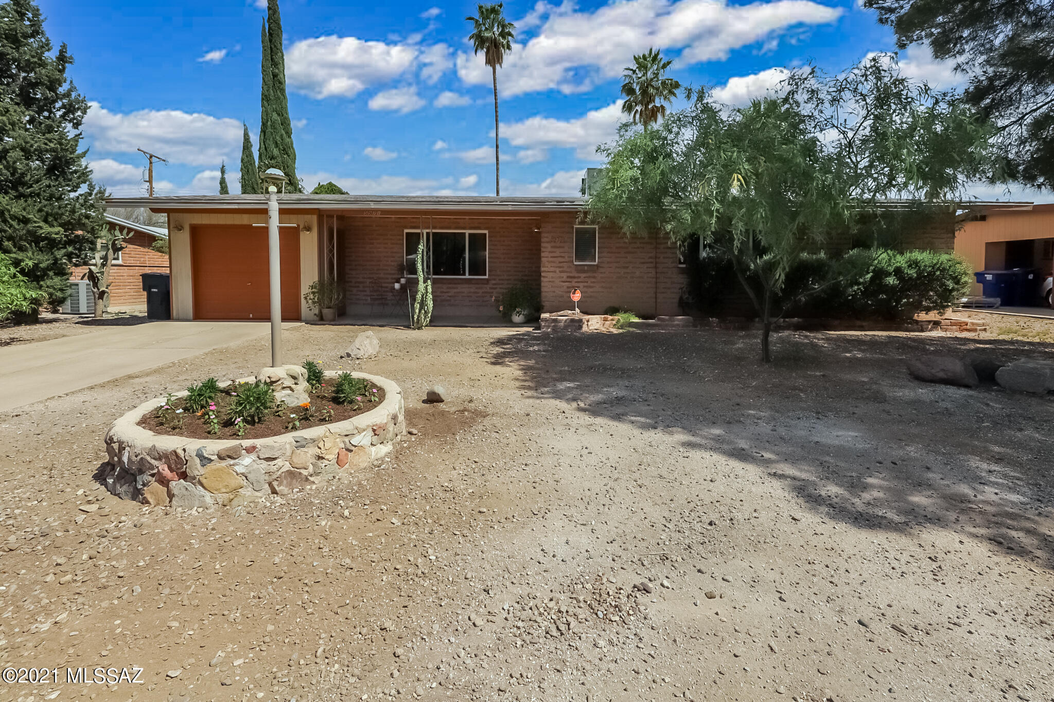 Centrally located, this beautifully remodeled 3br/2ba home is ready for new owners.  Sitting on almost ¼ acre and boasting over 2,000sqft you will have plenty of room for entertaining inside and out.  Fall in love with the gorgeous new kitchen that includes SS appliances, open shelving and an abundance storage with extra counter space.  Rich wood laminate floors throughout the main living spaces and generously sized bedrooms. 2 remodeled bathrooms that include designer tile, fixtures and mirrors. The backyard is a mini oasis with new paver patio and mature citrus trees. Dual pane windows, AC, and a tankless water heater are just a few of the upgrades you will inherit. Come see this one in person to truly appreciate.