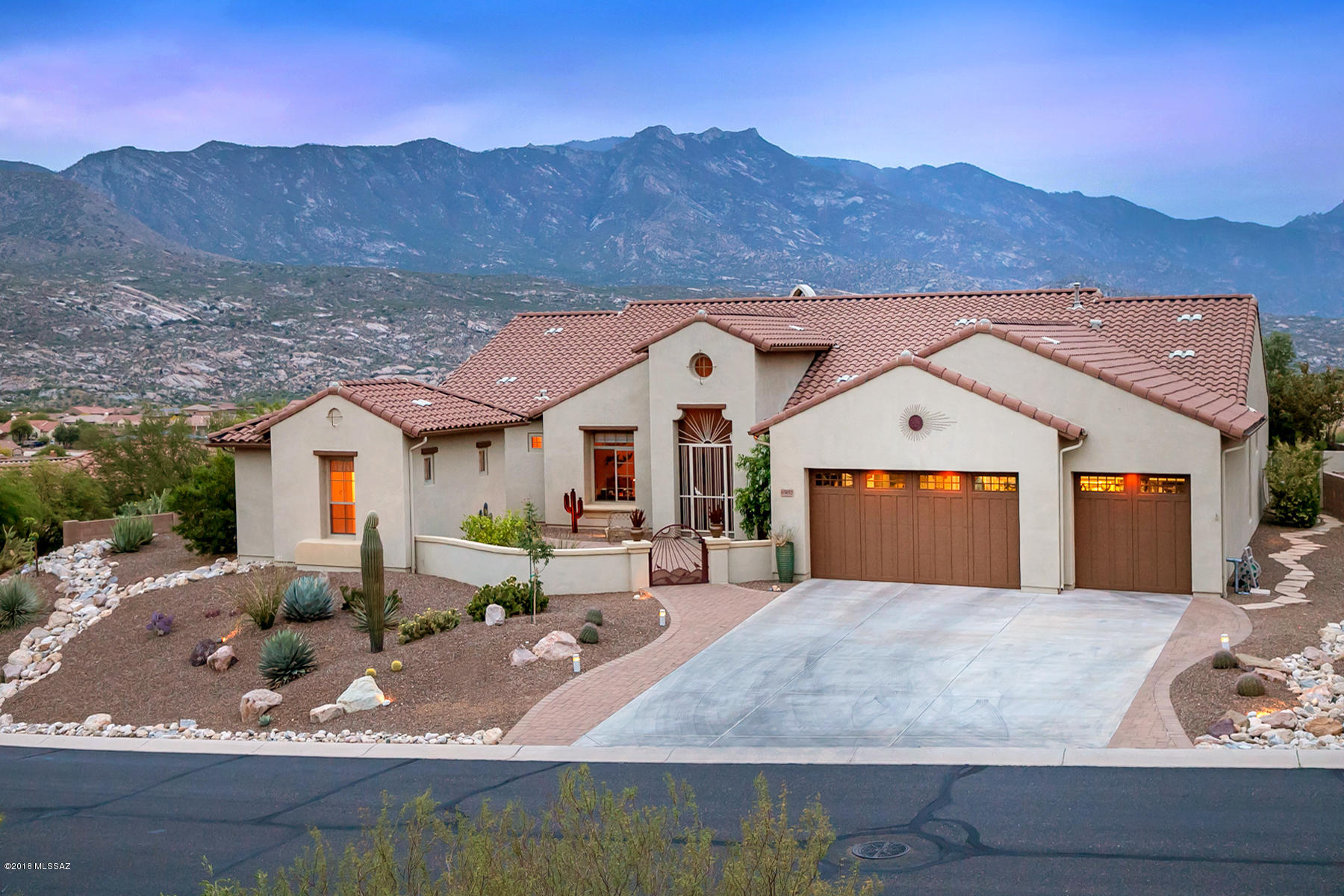 Beautiful Tierra plan in The Preserve at SaddleBrooke w/ AMAZING Mountain, City, Sunrise & Sunset views. South facing patio offers panoramic views of the Catalina Mountains. Tierra plan offers a large great room with a corner fireplace. Large windows offer beautiful views from the moment you walk in the front door. Open Kitchen with Corian countertops, gas cooktop, bisque appliances and beautiful maple cabinetry. Luxurious master bathroom offers separate vanities, large walk-in shower and air jetted tub. Guest bedrooms have Jack-and-Jill bathroom. Butler's pantry. Dry bar. Extra cabinets in Utility Room. Remote controlled window blinds in great room and guest bedrooms. Large 3 car garage with built-in cabinets and air-line for air compressor. Recirculating pump w/timer at hot water heater