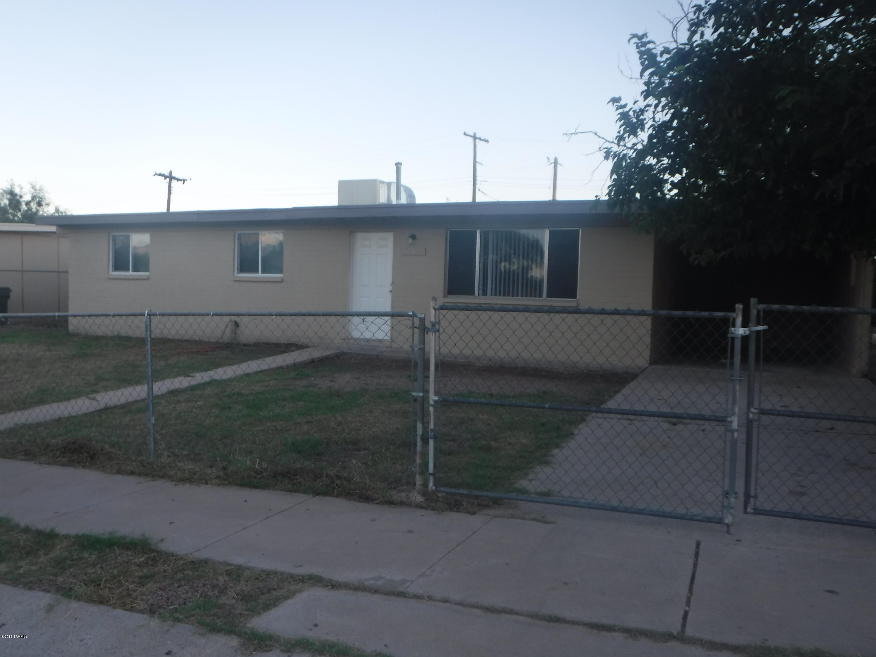 3 BR 2 BA house for rent. House has fenced front area, 1 car carport and large fenced back yard with patio. Tile throughout. Eat in kitchen, appliances include a side-by-side fridge and gas stove with microwave. Spacious closets in bedrooms. Evaporative cooling. Washer/dryer hookups. Tenants pay all utilities. Pets welcome with a $500 deposit.