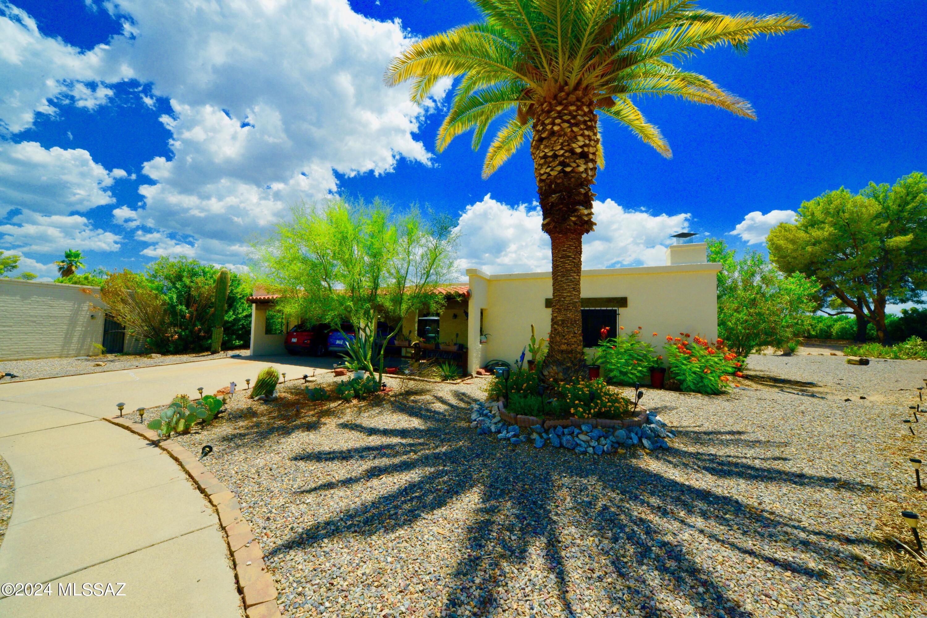 WOW the potential for such amazing things awaits you! This 2BD 2BA home is situated in a cul-de-sak on a picturesque pie-shaped 0.235-acre parcel with oodles of storage and wonderful bones to make your perfect 'home sweet home'. Insides, you will be delighted with the 2 large living spaces with the ultimate man-cave, she-shed, gym or hobby-land. There is room for everything in this home with a large laundry room and office, plus a workshop in the 2-car carport. Enjoy a beehive fireplace, new SS appliances, plush double padding beneath the newer carpet and vibrant paint throughout. Whether you wish for a pool, a haven for your furry companions, or even a flourishing orchard, this property provides the canvas to bring your dreams to life.