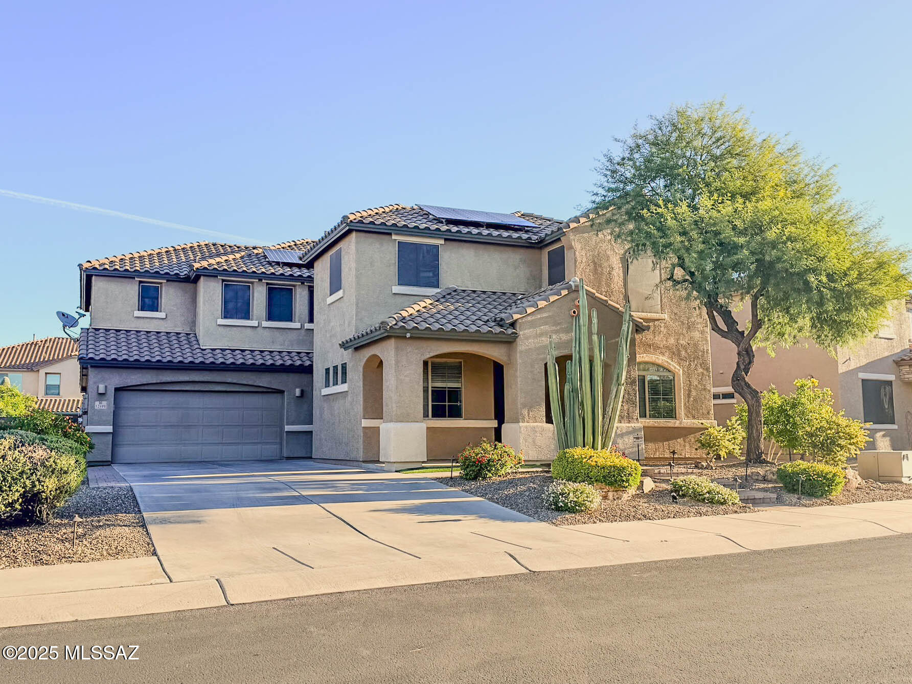 Gorgeously upgraded 6bd/4bth home on oversized lot with pool and owned solar system! The popular Badra floorplan with formal living room, great room, separate entertainment room off ofthe great room, loft, guest suite down stairs, and storage room off of garage. Gourmet kitchen features quartz counters, cherry wood cabinets, large island, and SS appliances. Travertine tile in all walkways and wet areas. Custom built in cabinetry in greatroom, storage room, and laundry room. Oversized rooms, beautiful bathrooms, and lots of living space. Resort style backyardoffers pool, turf, brick pavers, covered patio, and easy care landscaping. Large 3 Car Garage, covered porch, and patio! Two community parks, one within view of house, and gated community! Owner is licensed real estate broker in AZ.