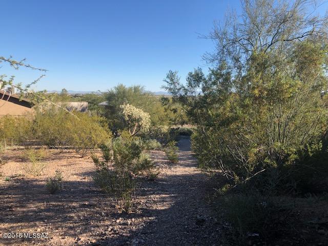 Just a hop and a skip from downtown at the foot of A-Mountain.  Won't last long. Flat buildable lot begging for a new owner. Zoned R1. All utilities at the lot line. Use your imagination and build your dream home in this almost 1/4 acre lot! Have the best 4th of July parties in town here with first rate views of the fireworks show! Fenced on 3 sides. There aren't too many lots left in Tucson that haven't been built on yet. Driveway built in from street over sidewalk already. Don't delay buy this lot today! Seller may carry the note with acceptable terms. Buyer to verify location of utilities. NOT in a flood zone! Motivated Seller!